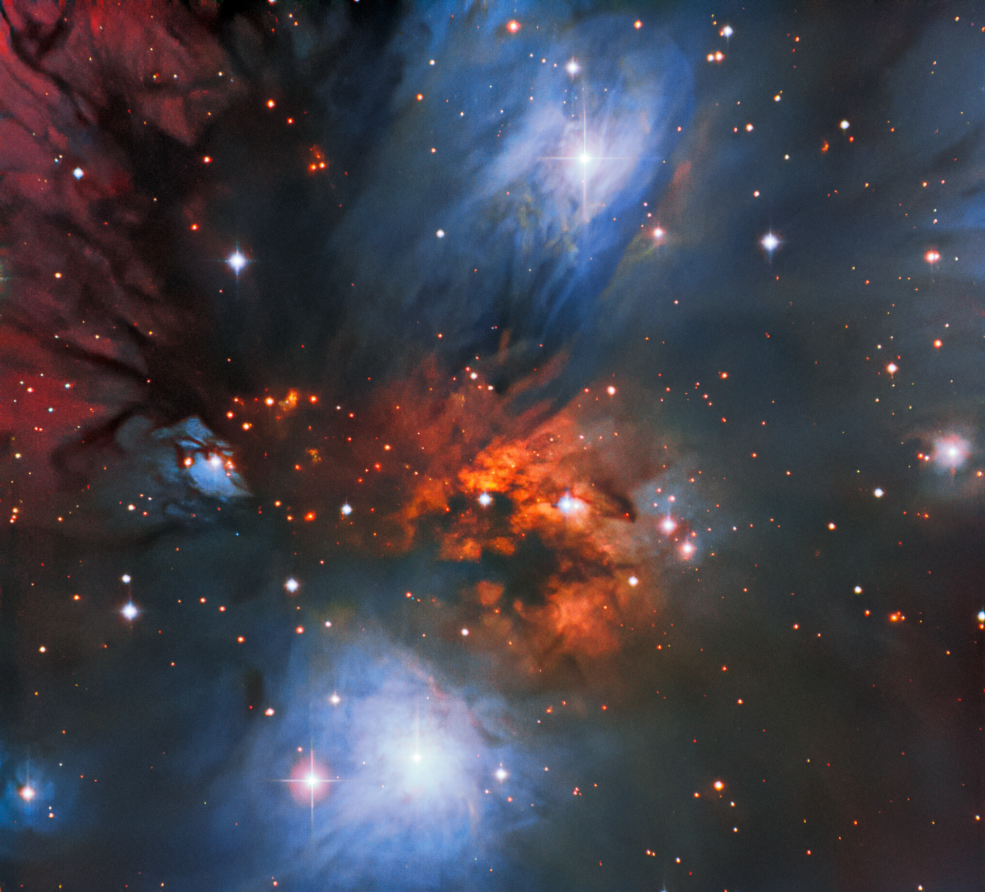 This striking image, streaked with bright swathes of color, captures the beautiful reflection nebula NGC 2170. The diffuse clouds of interstellar dust in the nebula scatter and reflect light from nearby stars, creating this vividly colorful scene. Dust grains reflect blue light from hot stars embedded in the nebula. And warm hydrogen gas glows a deep red. Seen as dark tendrils, dust also absorbs the light from stars and gas behind it. This particular nebula lies in the constellation Monoceros (The Unicorn) — a faint constellation on the celestial equator. It was observed using the SMARTS 0.9-meter Telescope at Cerro Tololo Inter-American Observatory in Chile, a Program of NSF’s NOIRLab.  Credit: CTIO/NOIRLab/NSF/AURA Acknowledgments: Travis Rector (University of Alaska Anchorage), Mahdi Zamani & Davide de Martin