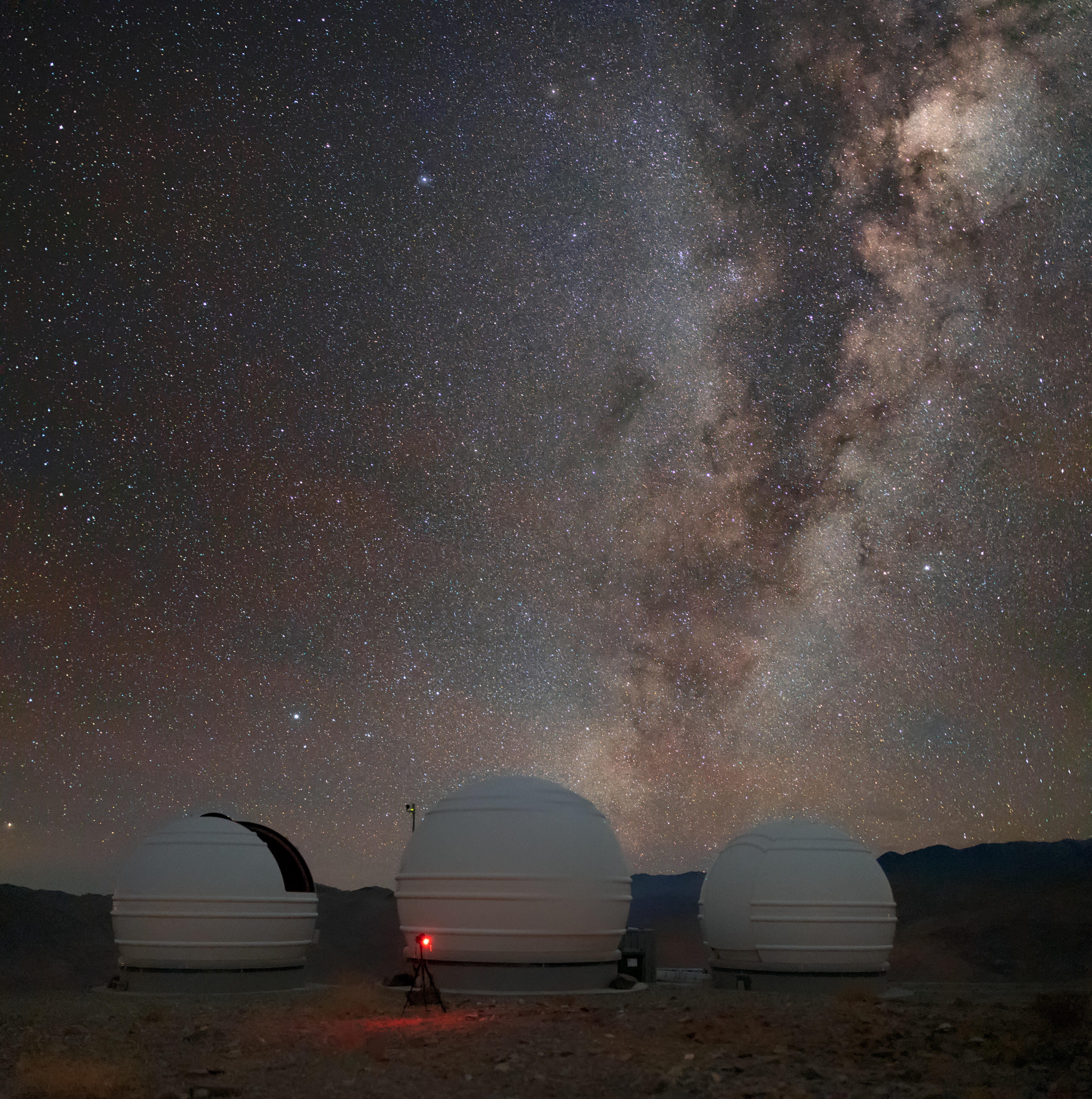 The Milky Way above the "Exoplanets in Transits and their Atmospheres" telescopes at La Silla Observatory in Chile.