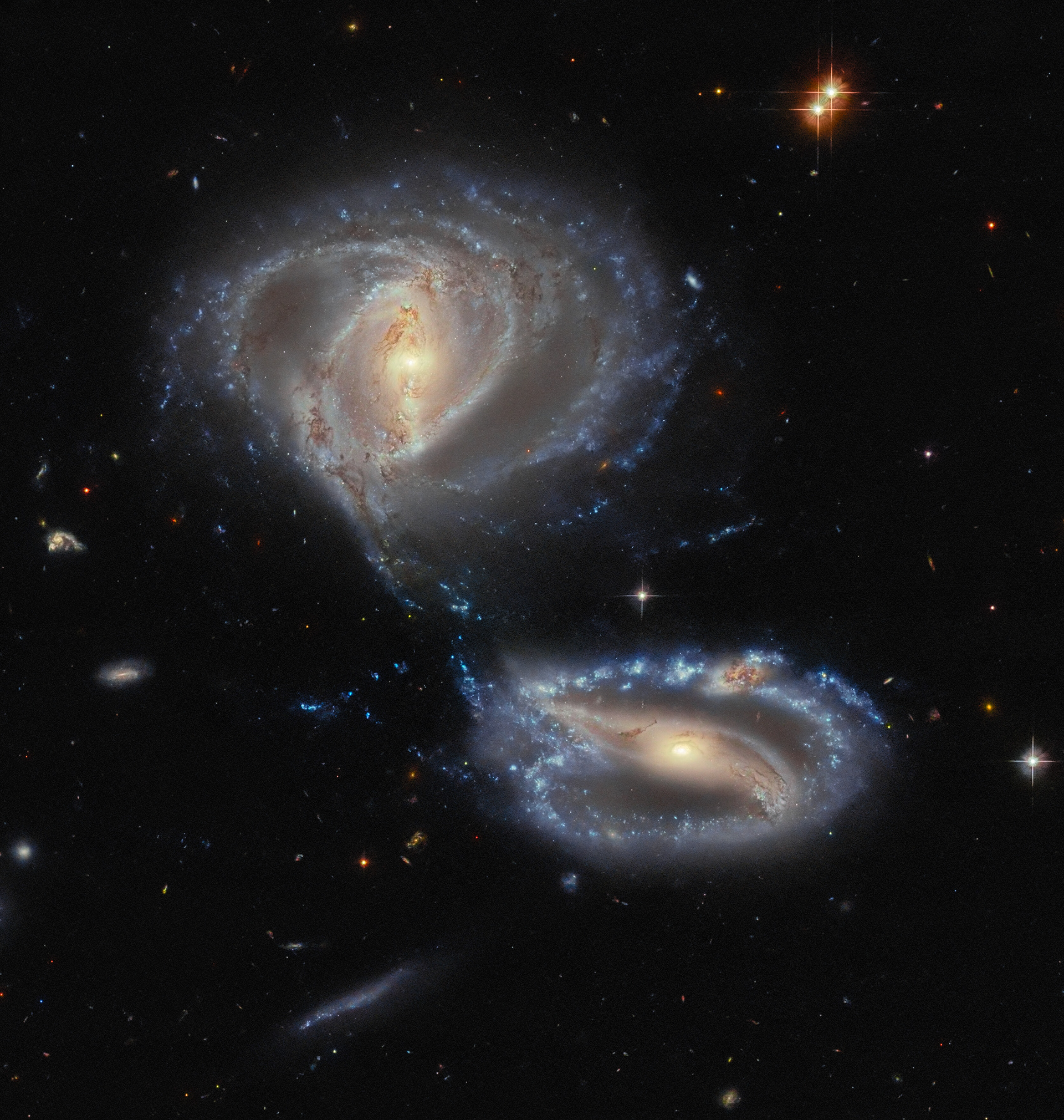A dynamic duo … or trio? - Credit: ESA/Hubble & NASA, J. Dalcanton, Dark Energy Survey/DOE/FNAL/NOIRLab/NSF/AURA Acknowledgement: L. Shatz