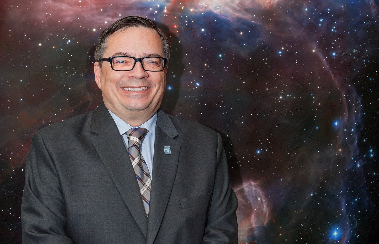 Xavier Barcons, days before becoming ESO's Director General on 1 September 2017, stands in front of the Flame Nebula panel at ESO's Headquarters in Garching, Germany.