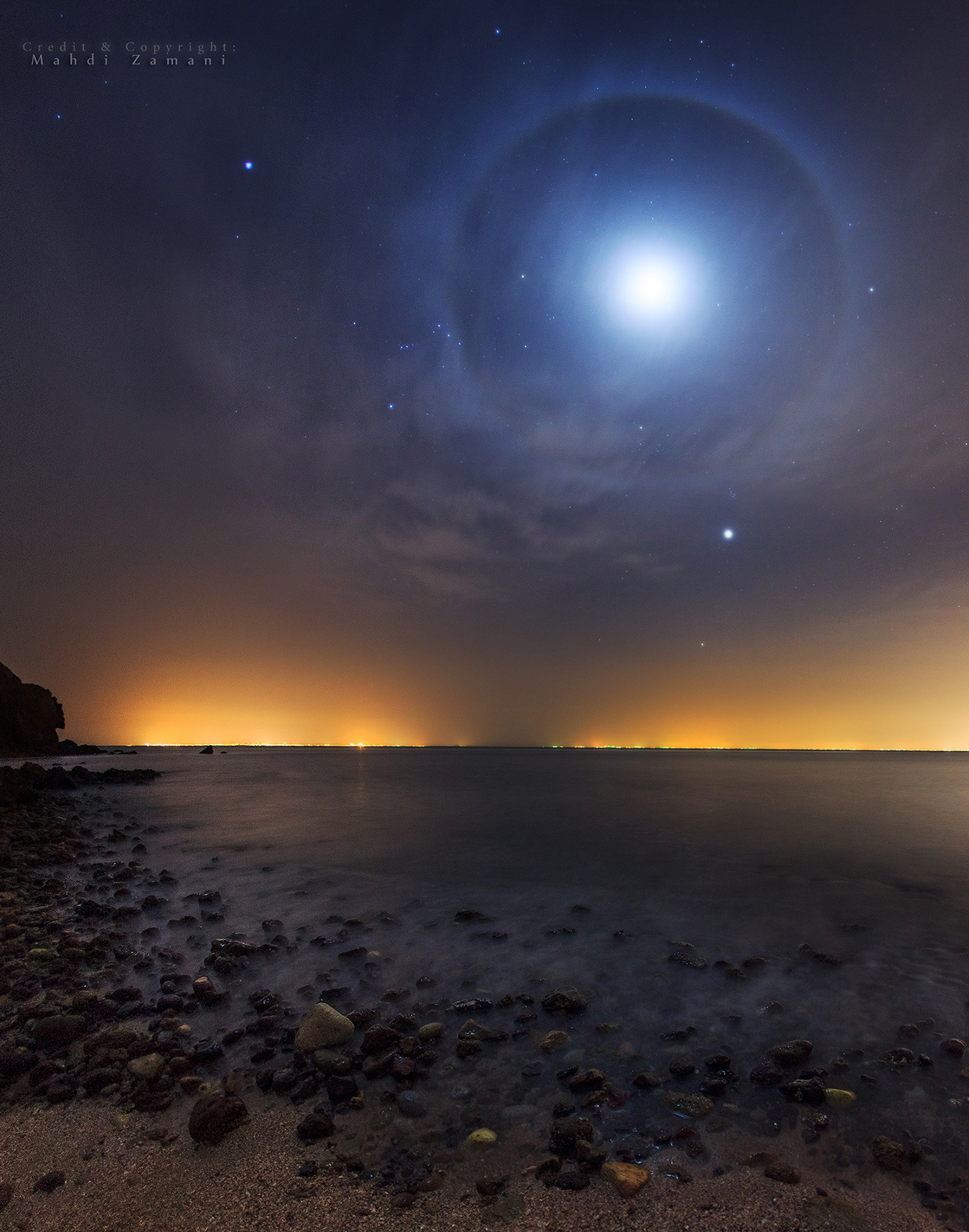 Halo moon, Venus and Jupiter over Persian gulf, Hormoz island, Iran, Mar2012