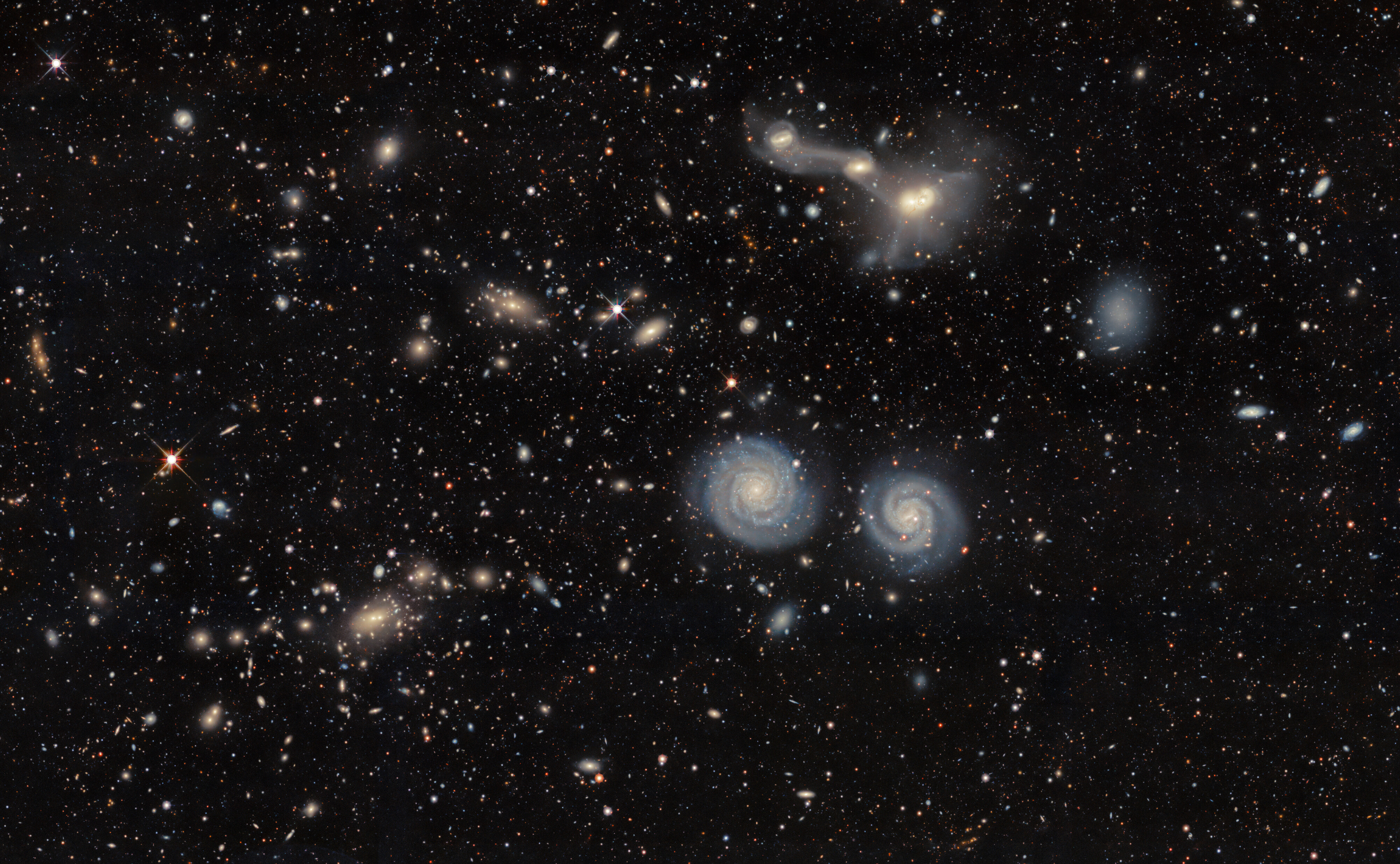A Galactic Illusion - Credit: DESI Legacy Imaging Surveys/LBNL/DOE & KPNO/CTIO/NOIRLab/NSF/AURA Image processing: T.A. Rector (University of Alaska Anchorage/NSF NOIRLab), D. de Martin & M. Zamani (NSF NOIRLab)