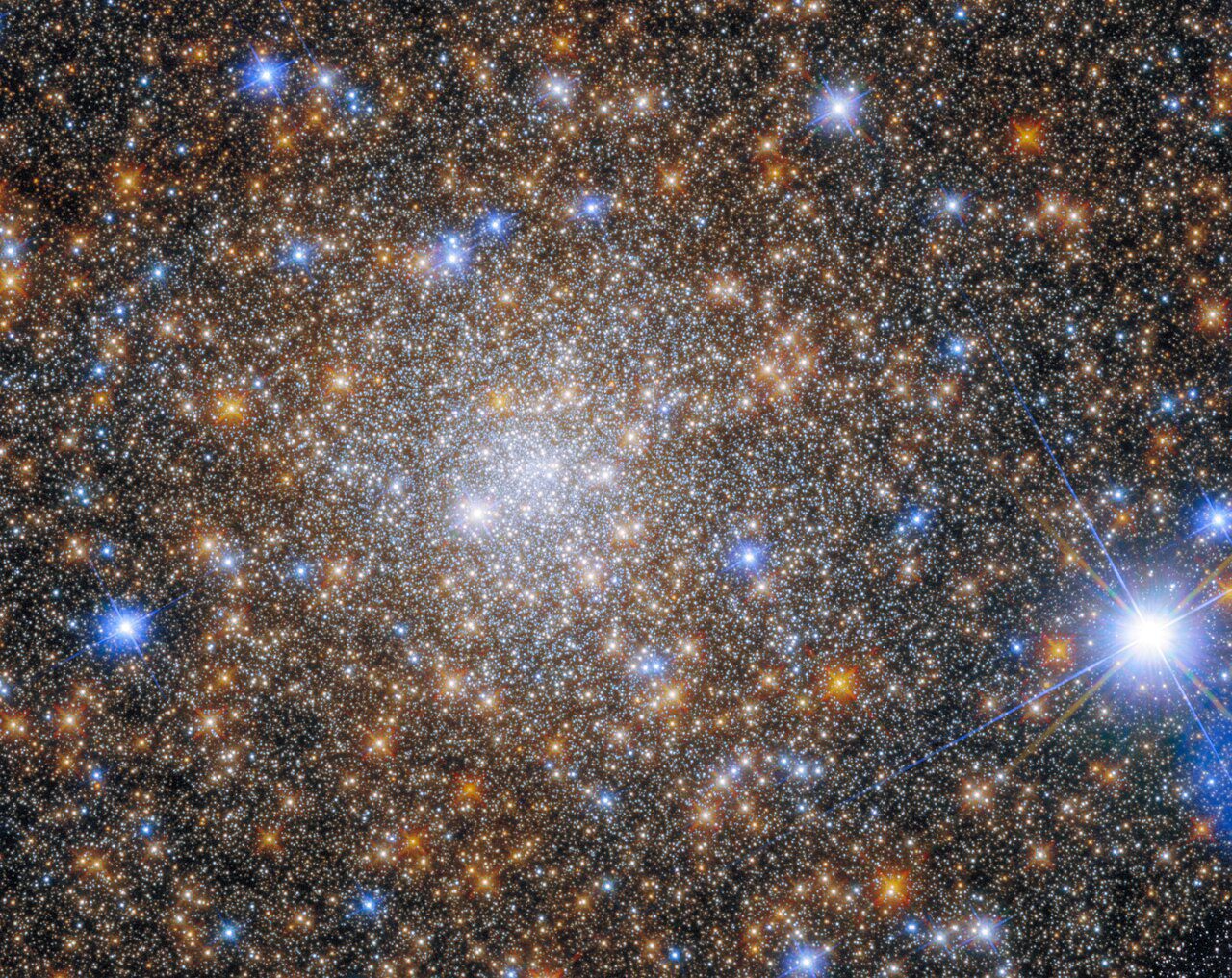 Terzan 1 is a globular cluster that lies about 22,000 light-years from Earth in the constellation Scorpius. It is one of 11 globular clusters that were discovered by the Turkish-Armenian astronomer Agop Terzan between 1966 and 1971 when he was working in France, based mostly at Lyon Observatory.  Somewhat confusingly, the 11 Terzan globular clusters are numbered from Terzan 1 to Terzan 12. This is due to an error made by Terzan in 1971, when he rediscovered Terzan 5 — a cluster he had already discovered and reported back in 1968 — and named it Terzan 11. He published its discovery alongside those of Terzan 9, 10 and 12. He quickly realised his mistake, and attempted to have Terzan 12 renamed as Terzan 11. Unfortunately, he did not make it clear that Terzan 5 and Terzan 11 were one and the same, although another astronomer, Ivan Robert King, did publish a note to try and clear up the confusion. Nowadays, most papers recognise the original Terzan 5 and Terzan 12, and accept the oddity that there is no Terzan 11. There have, however, been instances of confusion in the scientific literature over the past few decades.  Terzan 1 is not a new target for Hubble — an image of the cluster was released back in 2015, taken by Hubble’s Wide Field Planetary Camera 2 (WFPC2). That instrument was replaced by the Wide Field Camera 3 (WFC3) during the 2009 Hubble servicing mission. WFC3 has both superior resolving power and a wider field of view than WFPC2, and the improvement is obvious in this fantastically detailed image.   Links Video of Terzan 1, Take 2 Credit: ESA/Hubble & NASA, R. Cohen
