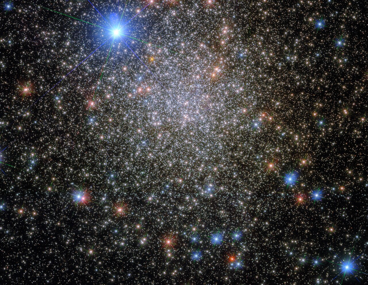 This image shows the globular cluster NGC 6380, which lies around 35 000 light-years from Earth, in the constellation Scorpio (The Scorpion). The very bright star at the top of the image is HD 159073, which is only around 4000 light-years from Earth, making it a much nearer neighbour to Earth than NGC 6380. This image was taken with Hubble’s Wide Field Camera 3 (WFC3), which, as its name suggests, has a wide field of view, meaning that it can image relatively large areas of the sky in enormous detail.  NGC 6380 is not a particularly exciting name, but it indicates that this cluster is catalogued in the New General Catalogue (NGC), which was originally compiled in 1888. This cluster has, however, been known by many other names. It was originally discovered by James Dunlop in 1826, and he rather immodestly named it Dun 538. Eight years later, in 1834, it was independently rediscovered by John Herschel and he (similarly immodestly) went on to name it H 3688. The cluster was re-rediscovered in 1959 in Paris by Pişmiş, who catalogued it as Tonantzintla 1 — and who, to continue the pattern, also referred to it as Pişmiş 25. In addition to its colourful history of rediscovery, up until the 1950s NGC 6380 was thought to be an open cluster. It was A. D. Thackeray who realised that it was in fact a globular cluster. Nowadays, this cluster is reliably recognised in widely available catalogues as a globular cluster, and referred to simply as NGC 6380.   Links Video of Rediscovered, Renamed, Reclassified Credit:  ESA/Hubble & NASA, E. Noyola