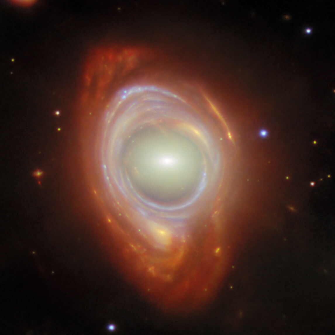 Spying a spiral through a cosmic lens - Credit: ESA/Webb, NASA & CSA, G. Mahler Acknowledgement: M. A. McDonald