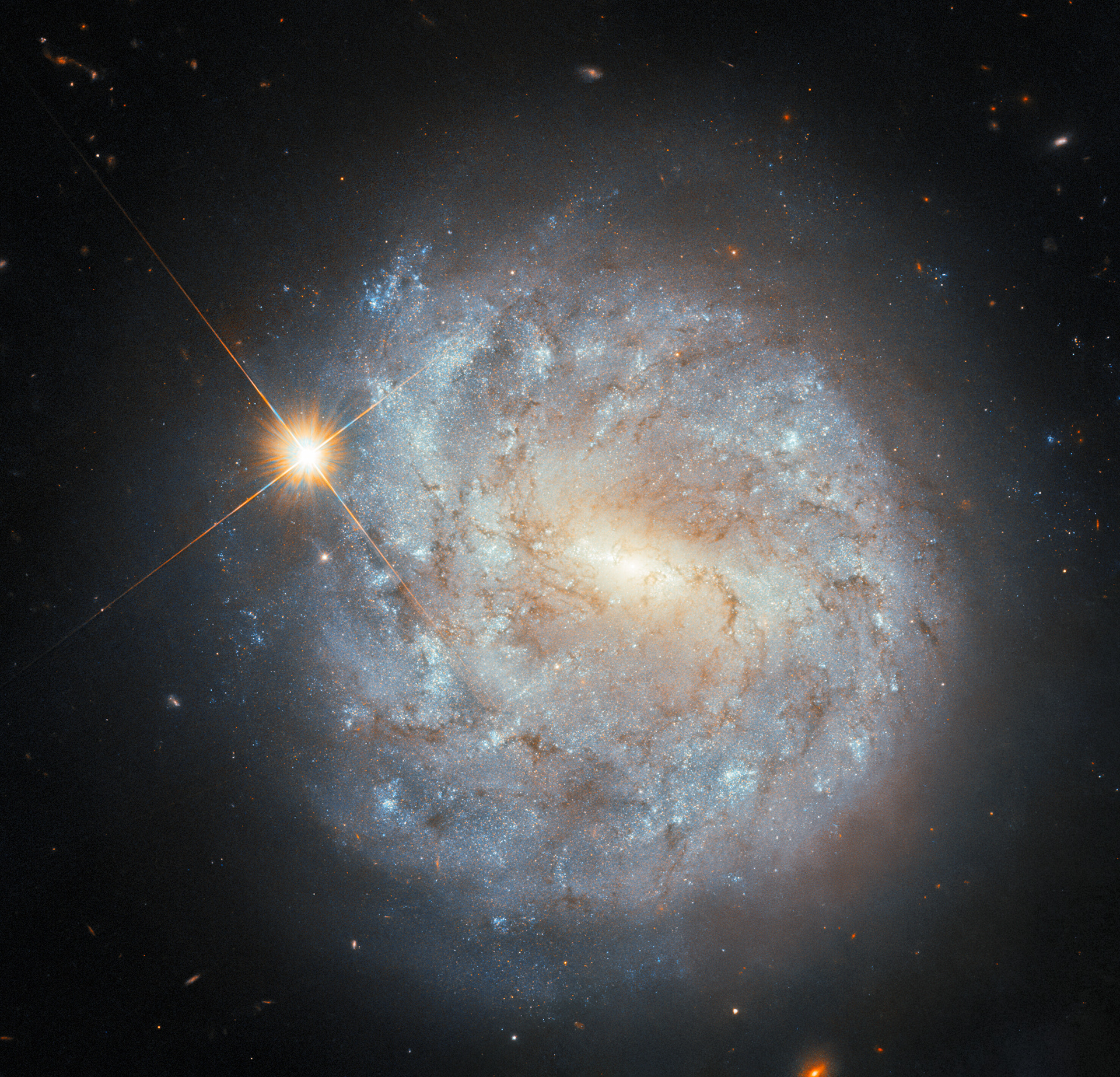 A spiral and a star - Credit: ESA/Hubble & NASA, S. J. Smartt, C. Kilpatrick