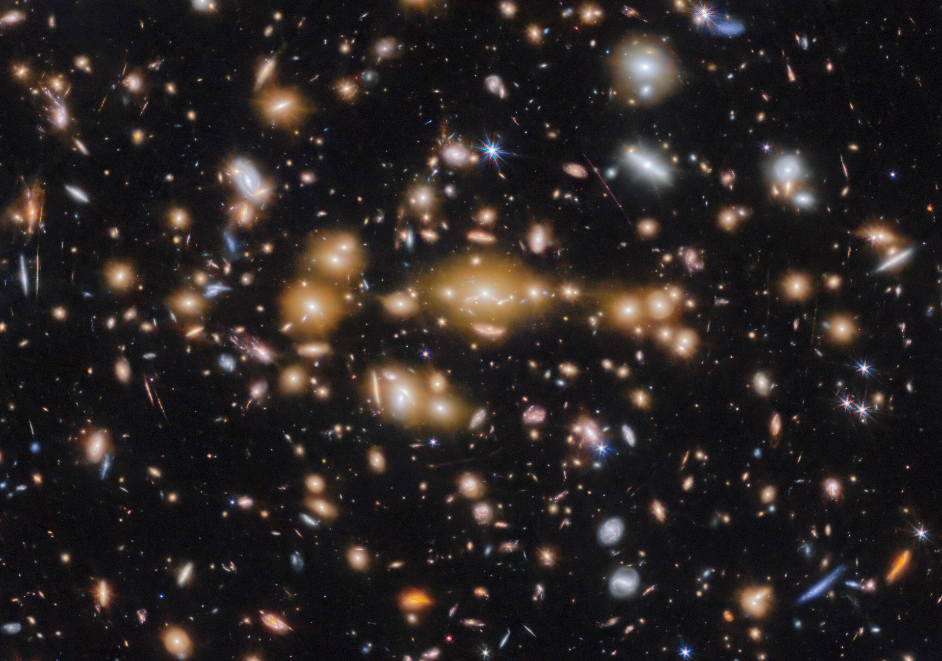 Galaxy cluster SPT-CL J0615−5746 (cropped) - Credit: ESA/Webb, NASA & CSA, L. Bradley (STScI), A. Adamo (Stockholm University) and the Cosmic Spring collaboration