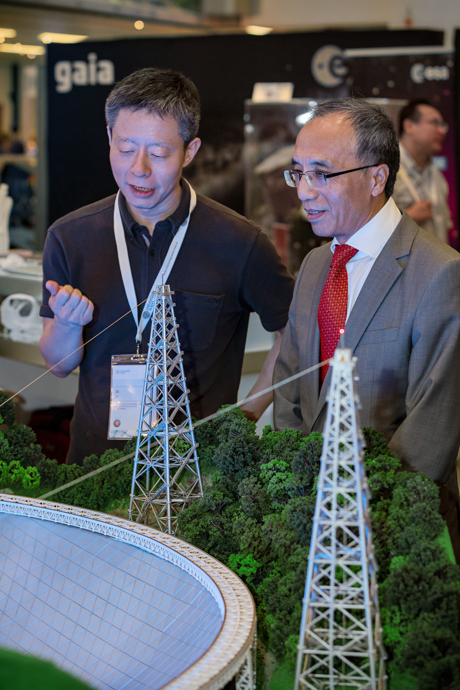 The ambassador of China, Xiaosi Li (right), visits the Chinese Astronomical Society exhibition stand at the IAU General Assembly in Vienna, Austria.