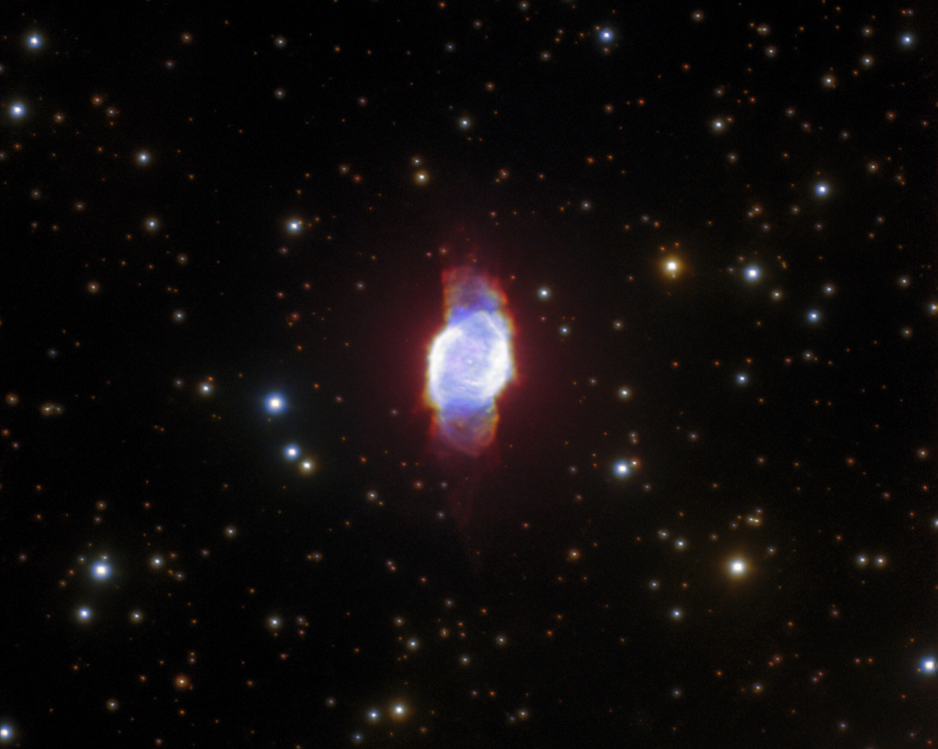 This gorgeous image resembles an inky patch of space that has been smudged by a giant celestial thumbprint. Actually the object is a planetary nebula named PN M 2-53. It was imaged using the Gemini North telescope of the international Gemini Observatory, a Program of NSF’s NOIRLab.  Planetary nebulae have a wildly misleading name, as they have nothing to do with planets — or even exoplanets. The misnomer originates from the late 1700s, when astronomers thought that the gaseous structures resembled planets. Planetary nebulae are actually formed by some dying stars, right at the end of their lives. The layers of gas and dust shed by the dying stars are lit by their remaining cores, creating a planetary nebula. Despite its inaccuracy, the name has stuck!  Credit: International Gemini Observatory/NOIRLab/NSF/AURA  Acknowledgements: PI: Rafael Andrés Pignata (Universidad Nacional de Córdoba) Image processing: T. A. Rector (University of Alaska Anchorage/NSF’s NOIRLab), J. Miller (Gemini Observatory/NSF's NOIRLab), M. Zamani & D. de Martin (NSF’s NOIRLab)