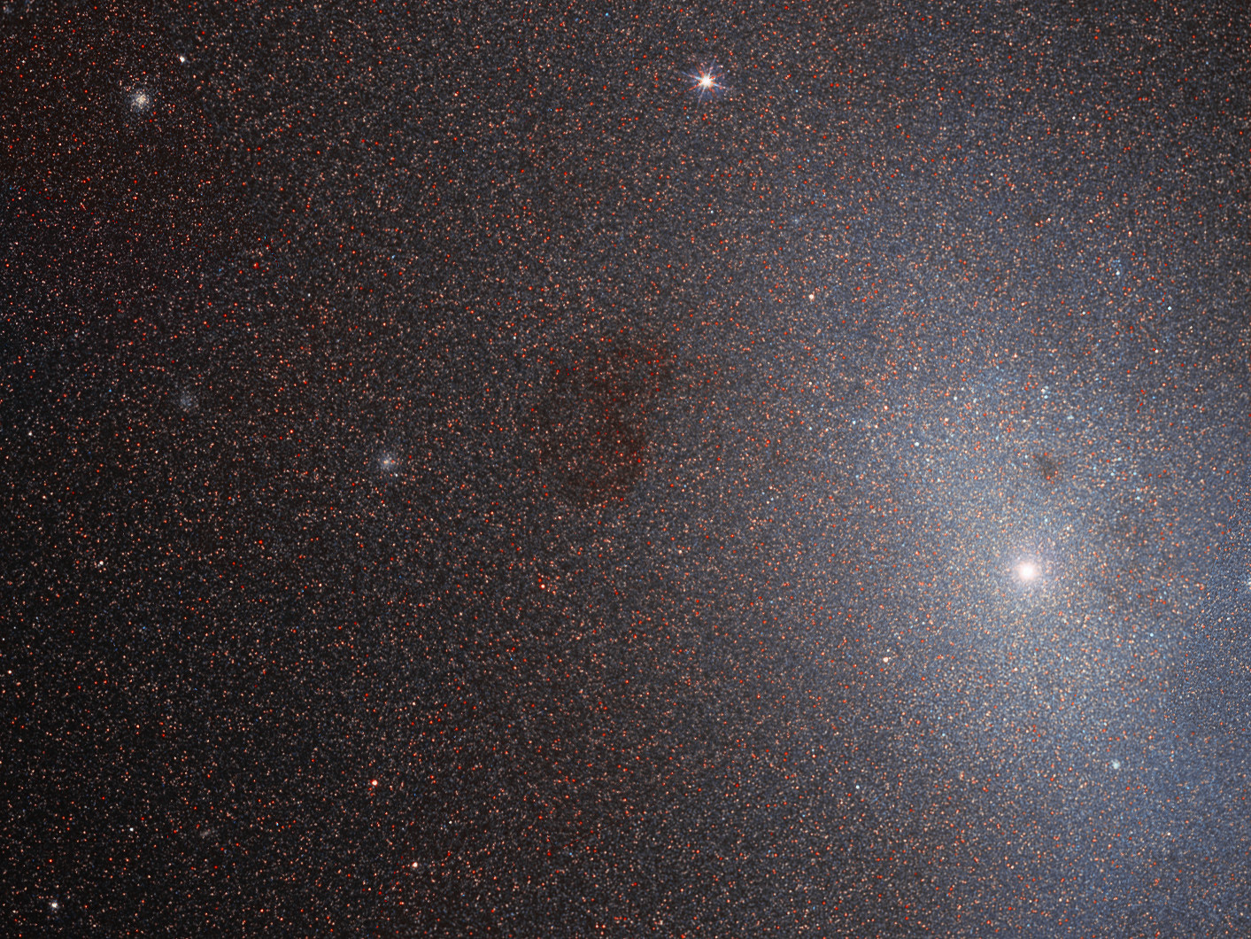 Many of the best-loved galaxies in the cosmos are remarkably large, close, massive, bright, or beautiful, often with an unusual or intriguing structure or history. However, it takes all kinds to make a Universe — as demonstrated by this Hubble Picture of the Week of Messier 110.  Messier 110 may not look like much, but it is a fascinating near neighbour of our home galaxy, and an unusual example of its type. It is a member of the Local Group, a gathering of galaxies comprising the Milky Way and a number of the galaxies closest to it. Specifically, Messier 110 is one of the many satellite galaxies encircling the Andromeda Galaxy, the nearest major galaxy to our own, and is classified as a dwarf elliptical galaxy, meaning that it has a smooth and almost featureless structure. Elliptical galaxies lack arms and notable pockets of star formation — both characteristic features of spiral galaxies. Dwarf ellipticals are quite common in groups and clusters of galaxies, and are often satellites of larger galaxies.  Because they lack stellar nurseries and contain mostly old stars, elliptical galaxies are often considered ‘dead’ when compared to their spiral relatives. However, astronomers have spotted signs of a population of young, blue stars at the centre of Messier 110 — hinting that it may not be so dead after all.  Credit: ESA/Hubble & NASA, L.Ferrarese et al.