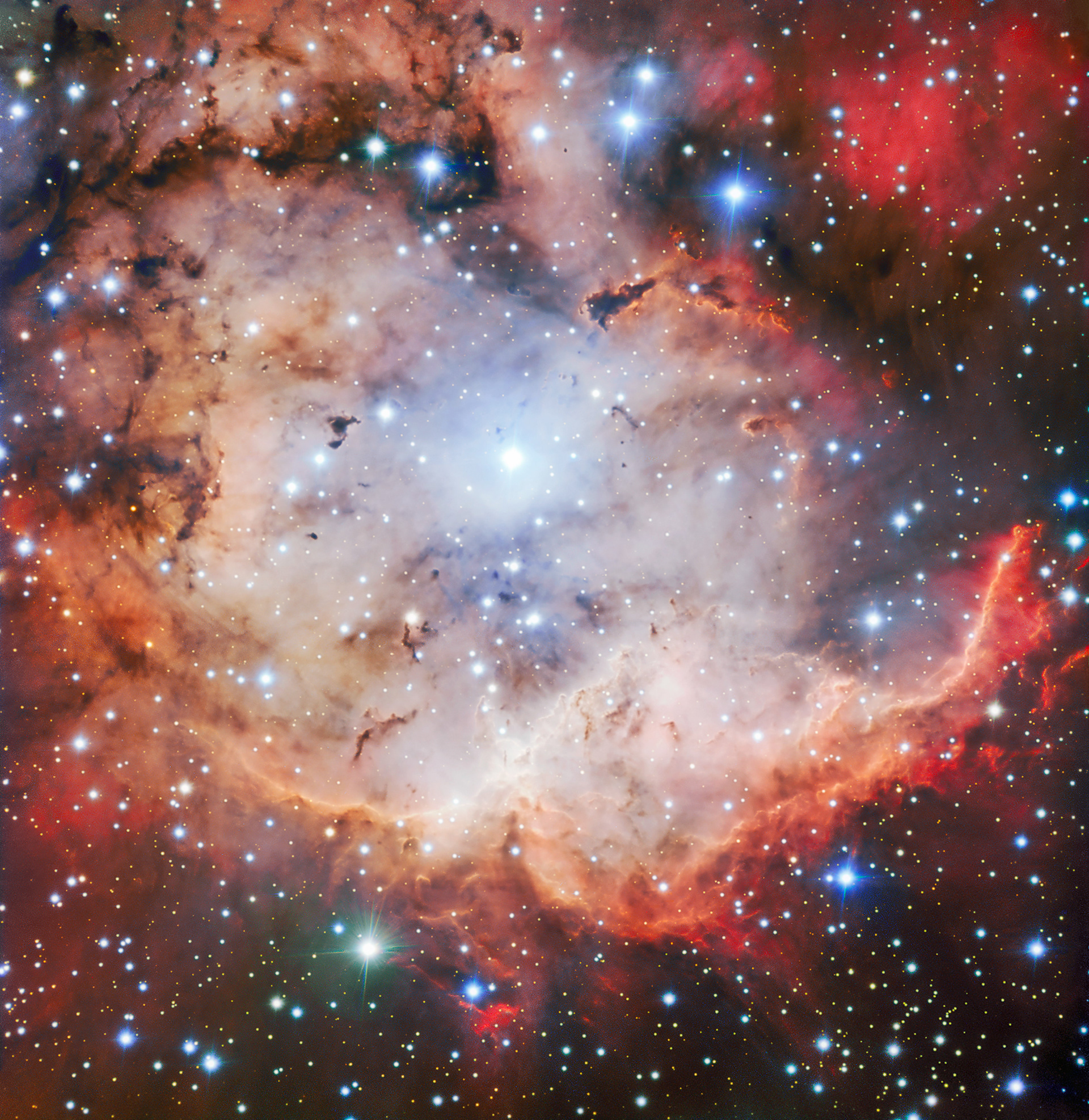 The Pirate of the Southern Skies This vivid picture of an active star forming region — NGC 2467, otherwise known as the Skull and Crossbones nebula — is as sinister as it is beautiful. This image of dust, gas and bright young stars, gravitationally bound into the form of a grinning skull, was captured with the FORS instrument on ESO’s Very Large Telescope (VLT). Whilst ESO’s telescopes are usually used for the collection of science data, their immense resolving power makes them ideal for capturing images such as this — which are beautiful for their own sake.  Credit: ESO
