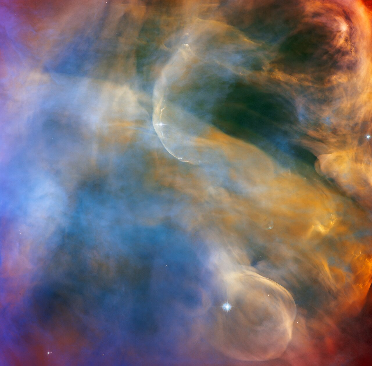This celestial cloudscape from the NASA/ESA Hubble Space Telescope captures the colourful region surrounding the Herbig-Haro object HH 505. Herbig-Haro objects are luminous regions surrounding newborn stars, and are formed when stellar winds or jets of gas spewing from these newborn stars form shockwaves colliding with nearby gas and dust at high speeds. In the case of HH 505, these outflows originate from the star IX Ori, which lies on the outskirts of the Orion Nebula around 1000 light-years from Earth. The outflows themselves are visible as gracefully curving structures at the top and bottom of this image, and are distorted into sinuous curves by their interaction with the large-scale flow of gas and dust from the core of the Orion Nebula.  This observation was captured with Hubble’s Advanced Camera for Surveys (ACS) by astronomers studying the properties of outflows and protoplanetary discs. The Orion Nebula is awash in intense ultraviolet radiation from bright young stars. The shockwaves formed by the outflows are brightly visible to Hubble, but the slower-moving currents of stellar material are also highlighted by this radiation. That allows astronomers to directly observe jets and outflows and learn more about their structures.  The Orion Nebula is a dynamic region of dust and gas where thousands of stars are forming, and is the closest region of massive star formation to Earth. As a result, it is one of the most scrutinised areas of the night sky and has often been a target for Hubble. This observation was also part of a spellbinding Hubble mosaic of the Orion Nebula, which combined 520 ACS images in five different colours to create the sharpest view ever taken of the region.  Links Video of A Celestial Cloudscape in the Orion Nebula    Credit: ESA/Hubble & NASA, J. Bally Acknowledgement: M. H. Özsaraç