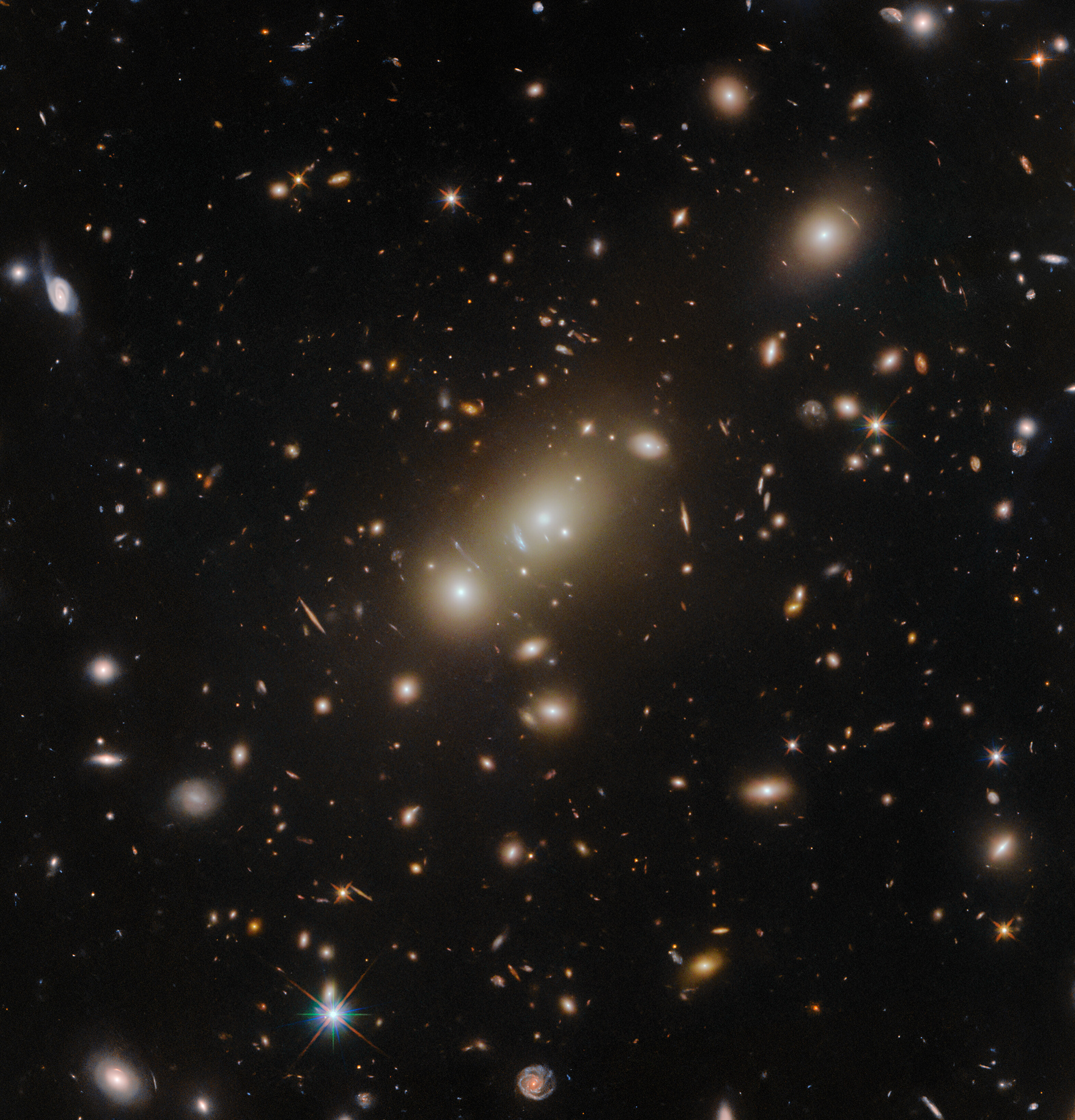 A clear view of a galaxy cluster - Credit: ESA/Hubble & NASA, H. Ebeling