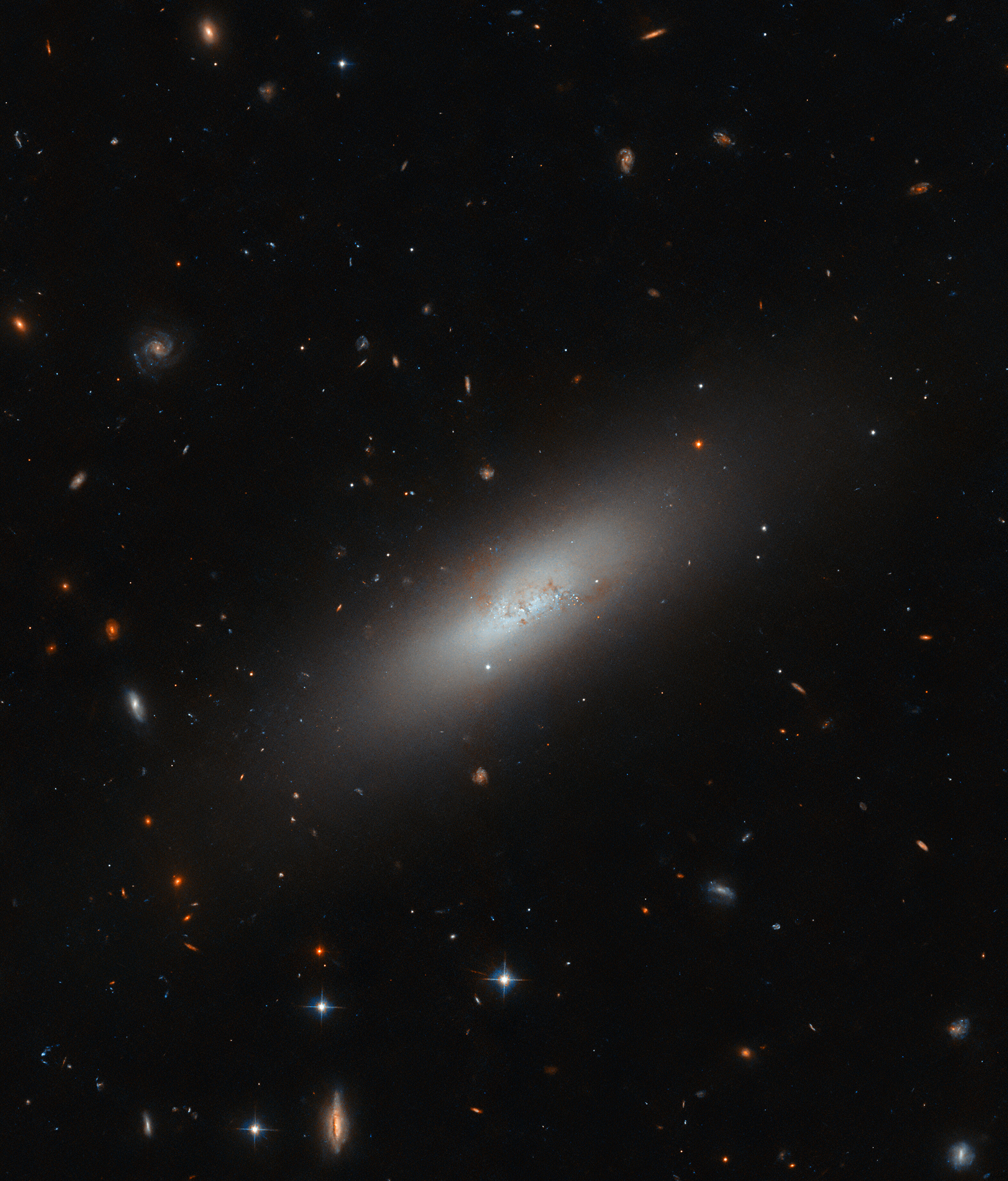 Galaxies in miniature - Credit: ESA/Hubble & NASA, M. Sun