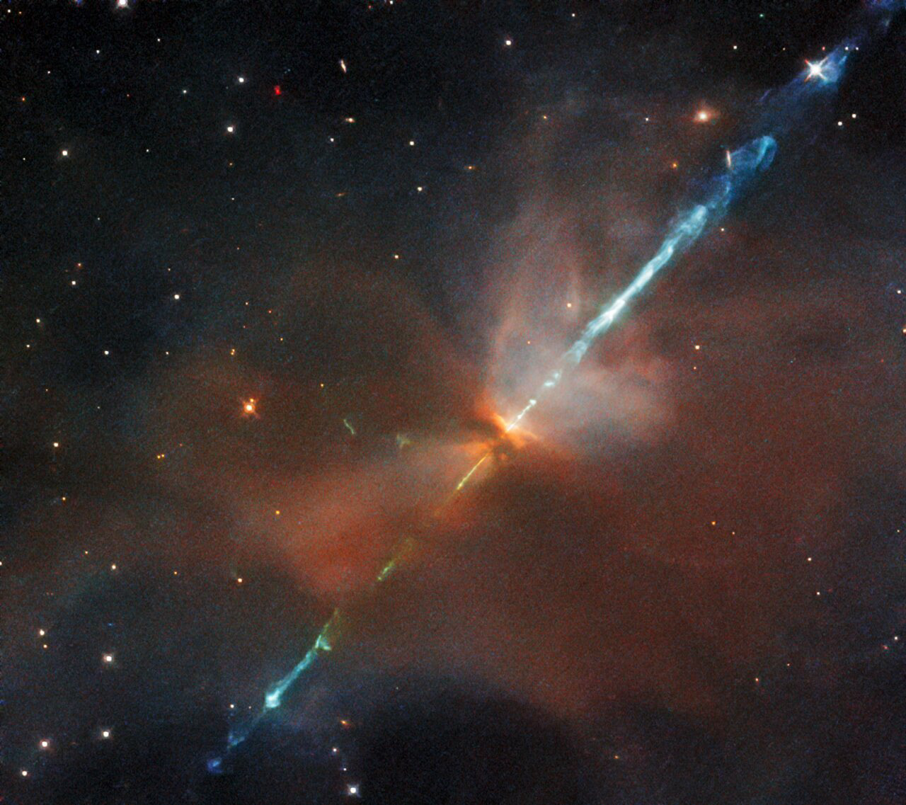 This striking image features a relatively rare celestial phenomenon known as a Herbig–Haro object. This particular Herbig–Haro object is named HH111, and was imaged by Hubble’s Wide Field Camera 3 (WFC3). These spectacular objects are formed under very specific circumstances. Newly formed stars are often very active, and in some cases they expel very narrow jets of rapidly moving ionised gas — gas that is so hot that its molecules and atoms have lost their electrons, making the gas highly charged. The streams of ionised gas then collide with the clouds of gas and dust surrounding newly-formed stars at speeds of hundreds of kilometres per second. It is these energetic collisions that create Herbig–Haro objects such as HH111.  WFC3 takes images at optical and infrared wavelengths, which means that it observes objects at a wavelength range similar to the range that human eyes are sensitive to (optical) and a range of wavelengths that are slightly too long to be detected by human eyes (infrared). Herbig–Haro objects actually release a lot of light at optical wavelengths, but they are difficult to observe because their surrounding dust and gas absorb much of the visible light. Therefore, the WFC3’s ability to observe at infrared wavelengths — where observations are not as affected by gas and dust— is crucial to observing Herbo–Haro objects successfully.   Credit: ESA/Hubble & NASA, B. Nisini