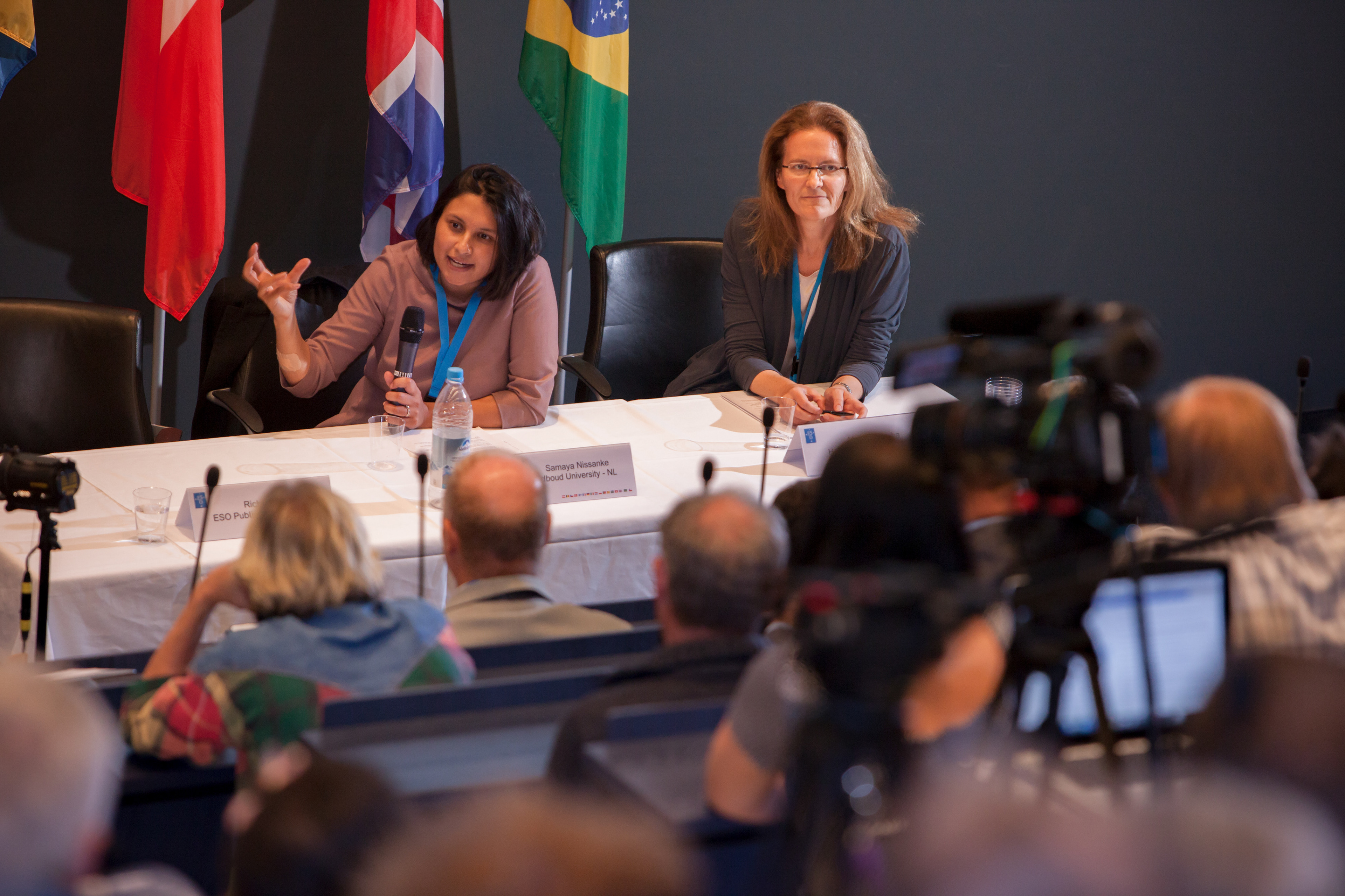 Samaya Nissanke, assistant professor at Radboud University and representative of the Virgo Interferometer, answers a question during the European Southern Observatory (ESO) press conference announcing the first discovery of a neutron star merger in Garching bei München on 16 October 2017.  Next to her is Marina Rejkuba, head of the User Support Department at ESO.