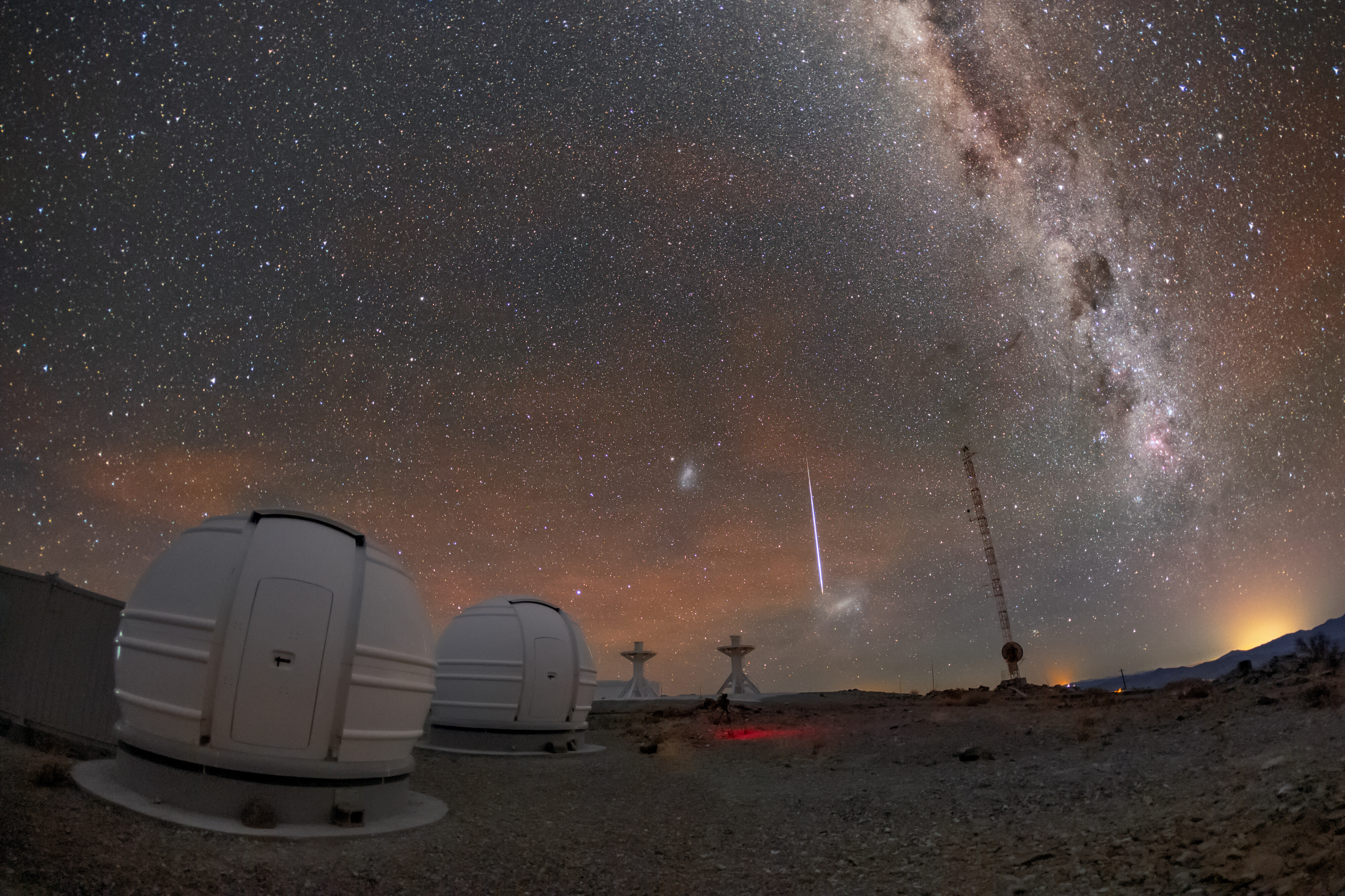 This picture of the week shows two of the three new ExTrA telescopes hosted at ESO’s La Silla Observatory in Chile. Situated over 2000 meters above sea level, these telescopes scour the skies for Earth-sized worlds around M class stars, which are stars smaller than the Sun.   A “shooting star” flashes across the night sky above the telescopes and towards the horizon of the Atacama Desert in Chile. Shooting stars are not actually stars, but small bits of rock or dust that enter the Earth’s orbit and burn up in the atmosphere. Before they enter Earth’s atmosphere, these tiny celestial bodies are called meteoroids.  The dramatic streaks of light caused by meteoroids burning up are not just beautiful and exciting, but also informative. Scientists look at the path and brightness of a meteoroid to determine where in the Solar System it came from and what it is composed of. If a meteoroid makes it through Earth’s atmosphere to the ground it is then called a meteorite. Scientists can study meteorites to learn more about the history of the Solar System.