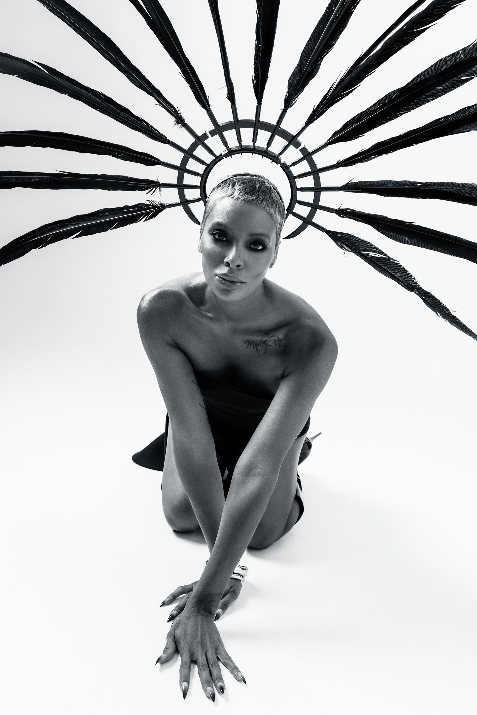 Eva Marcille · Radial feather headpiece