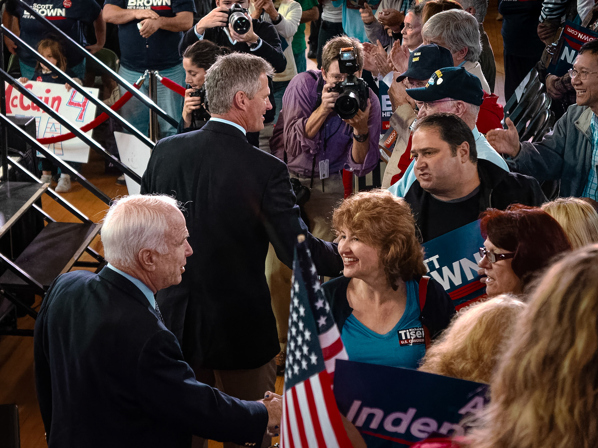 Senators John McCain and  Scott Brown great constituents during a rally at the Soldiers and Sailors Memorial Hall in Melrose, Massachusetts.