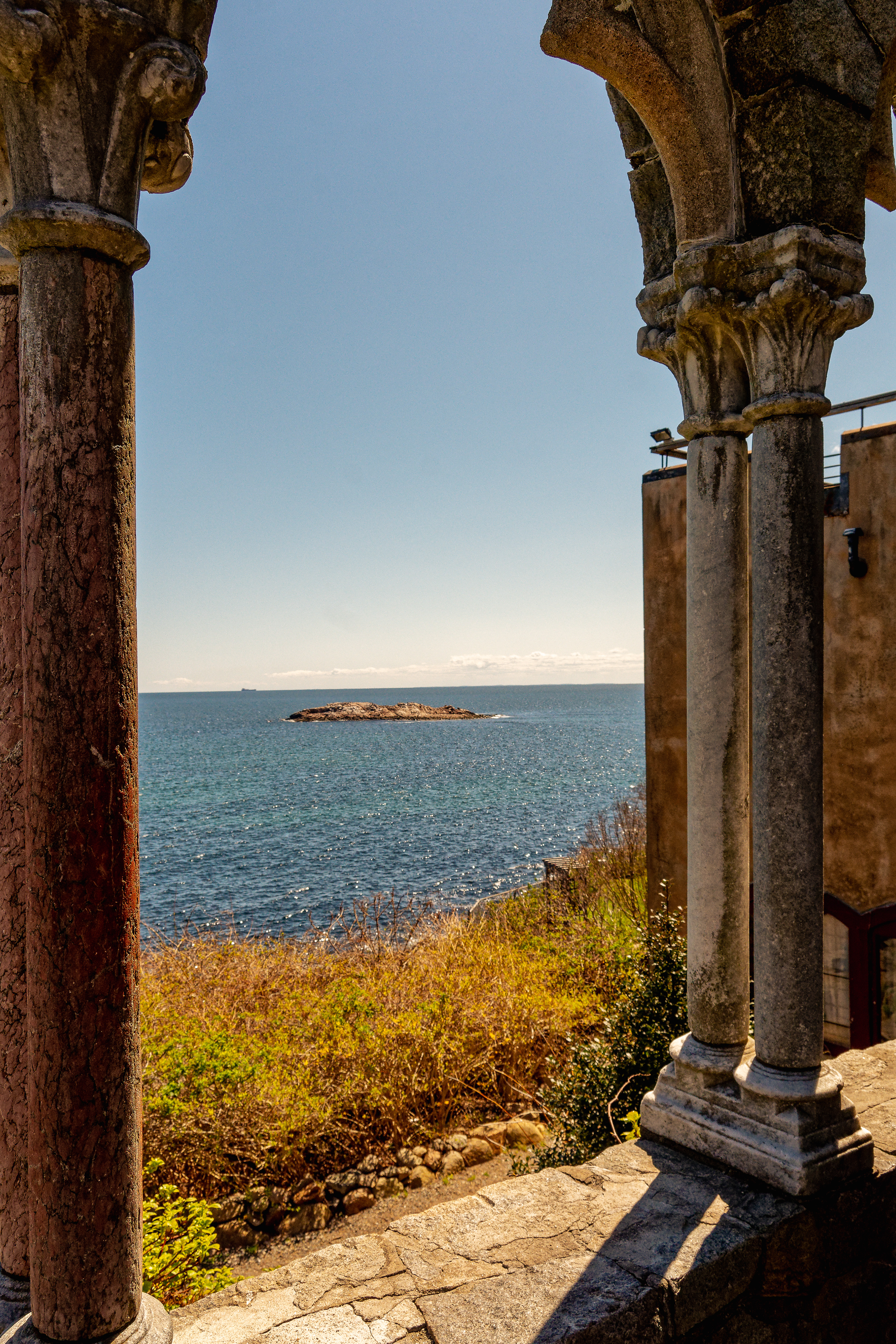 Stone arches overlooking a view of the deep blue Atlantic ocean
