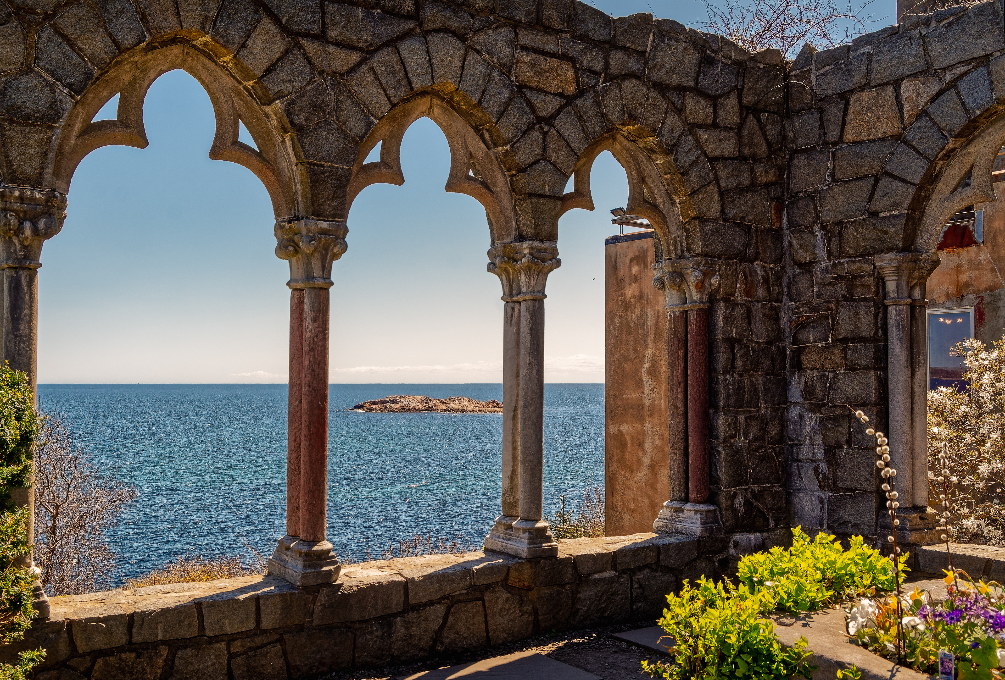 Stone arches overlooking a view of the deep blue Atlantic ocean