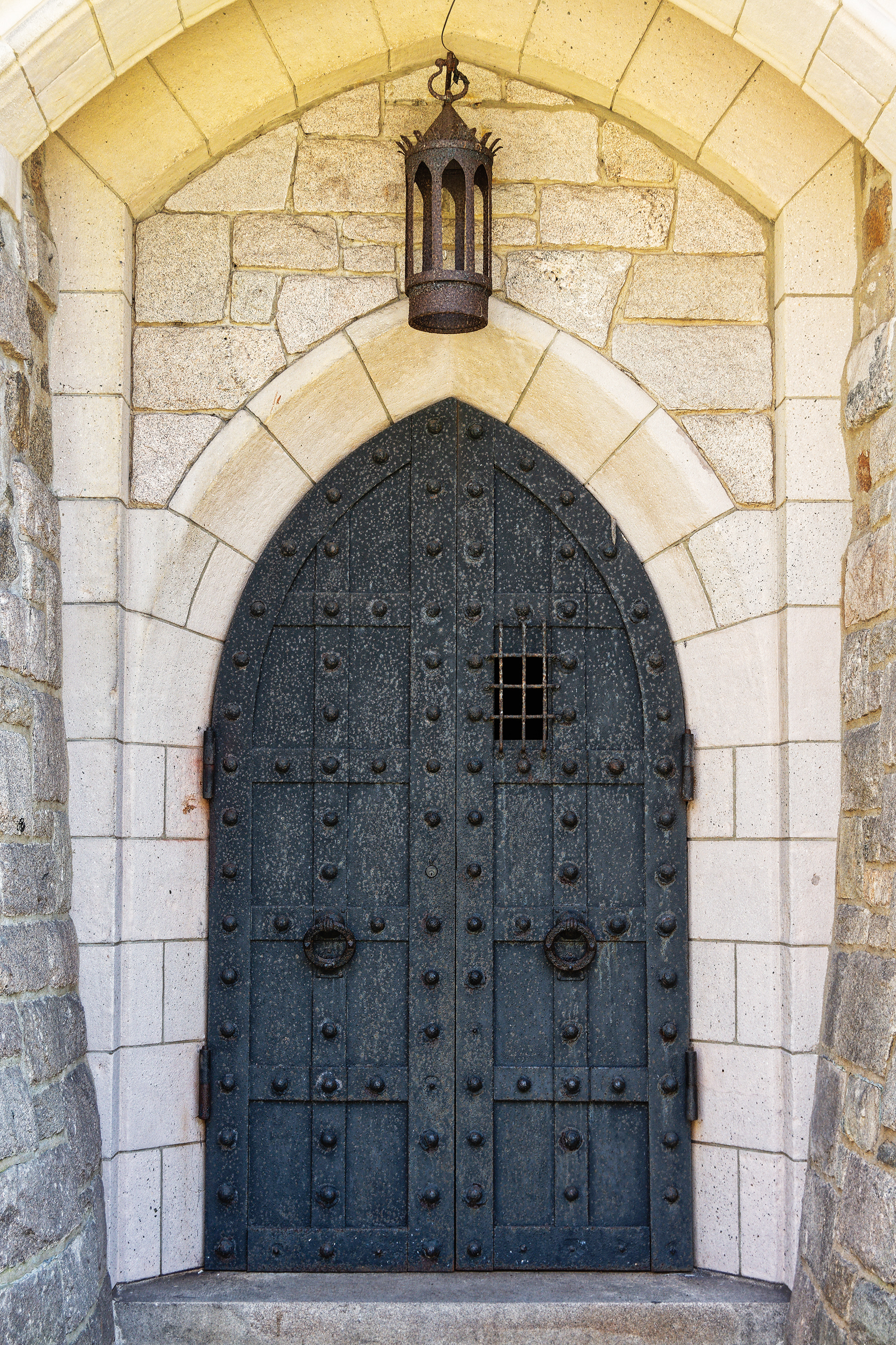 A fortified gray door to the 1926 Medieval-style Hammond Castle