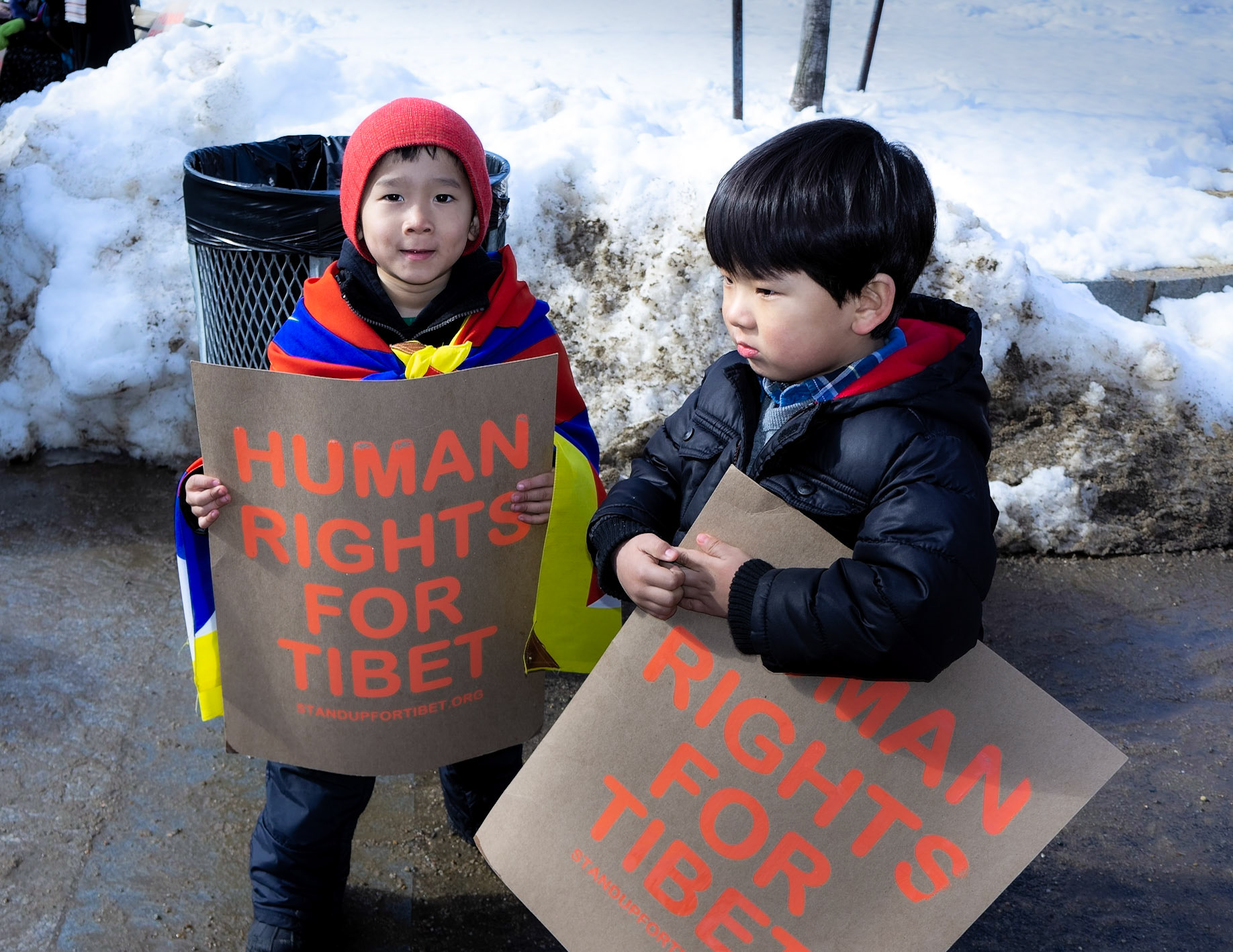 Young protesters hold signs in support of Tibetan human rights -  Boston, Massachusetts.