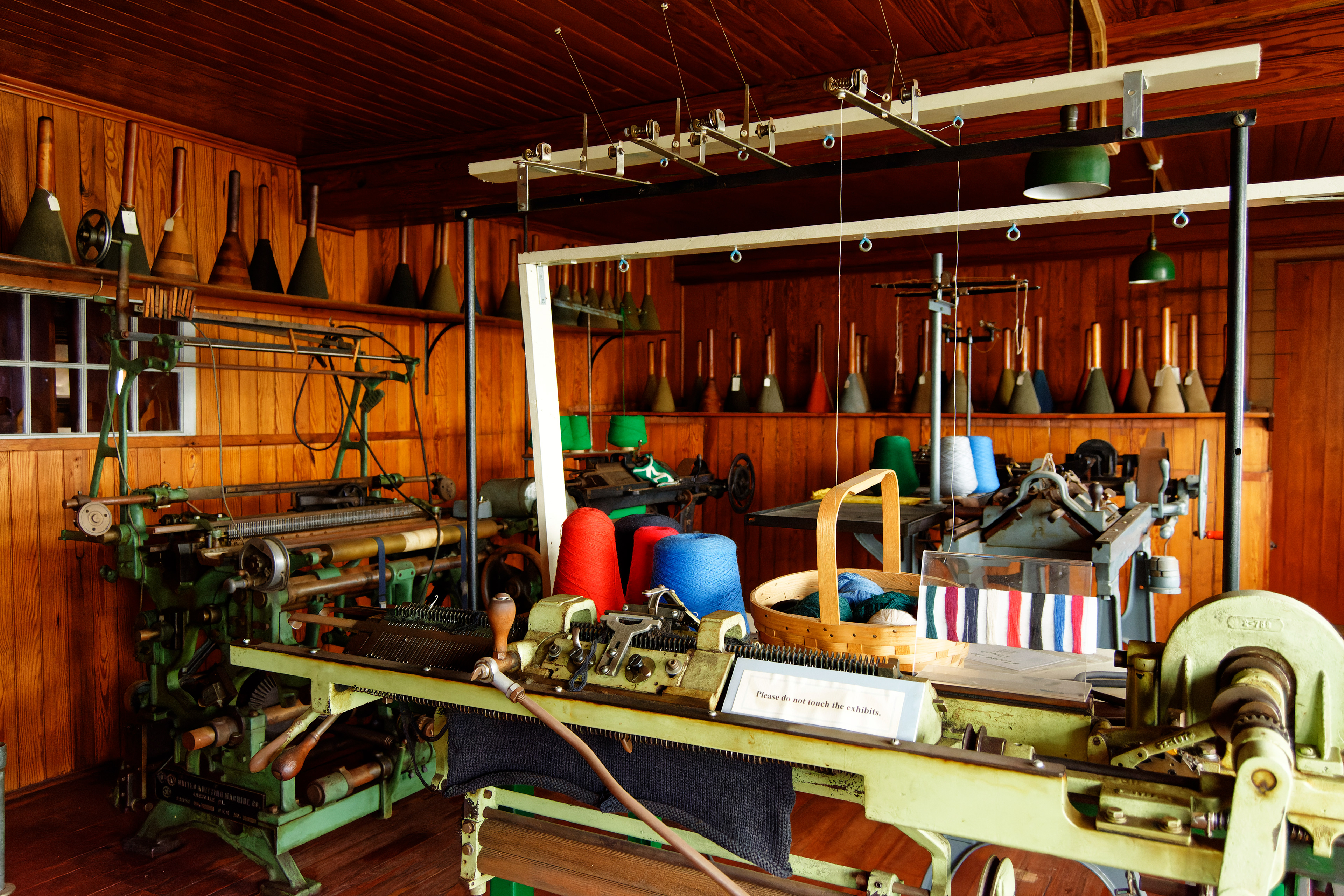 The wood-clad walls of the weaving room