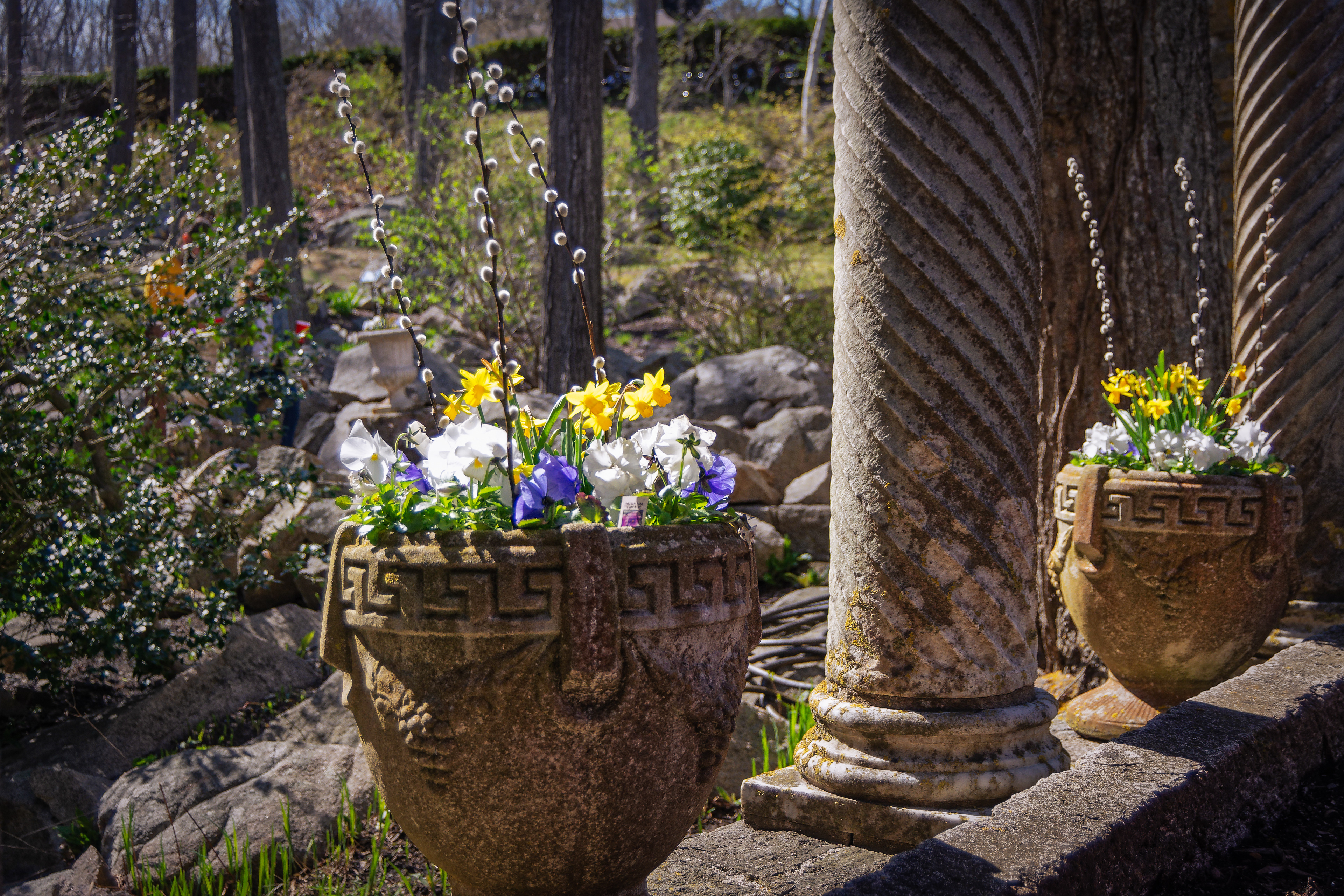 Beautiful stone columns surrounded by colorful flowers