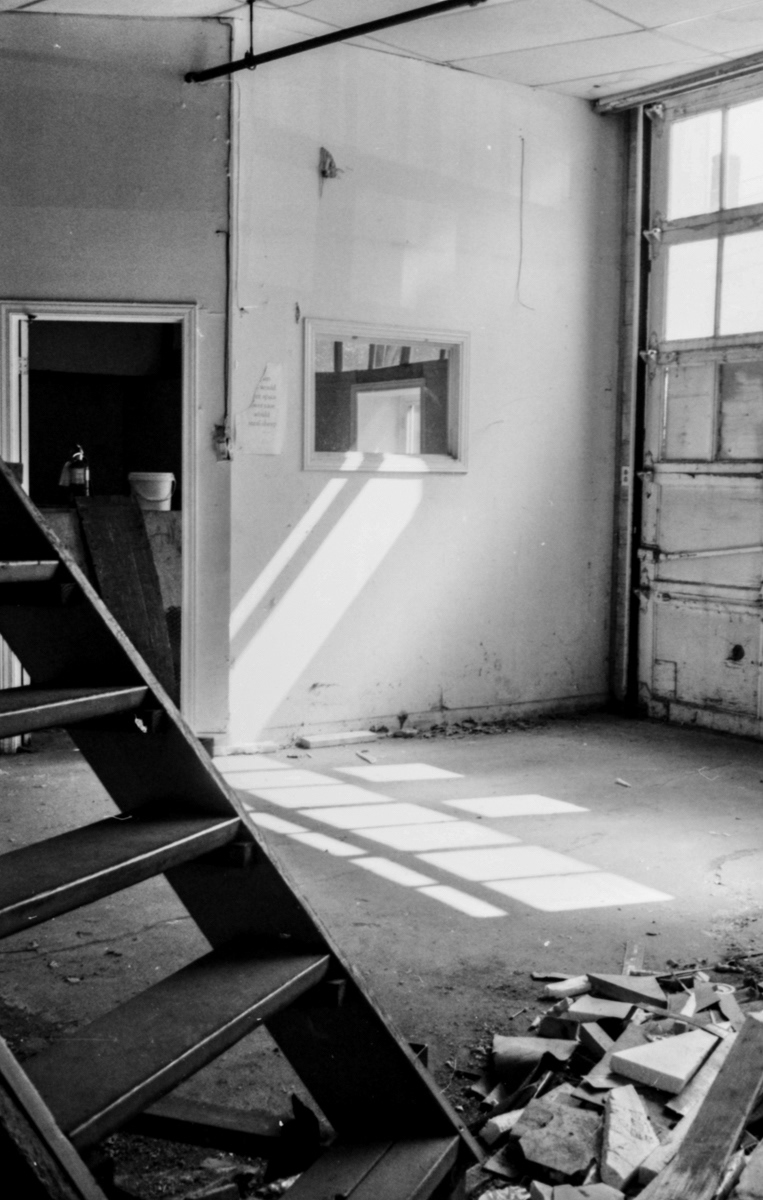 Stairs in Debris :: Robinson Building; Kentville, Nova Scotia, Canada; 2017. (Black and white film; developed by the photographer.)