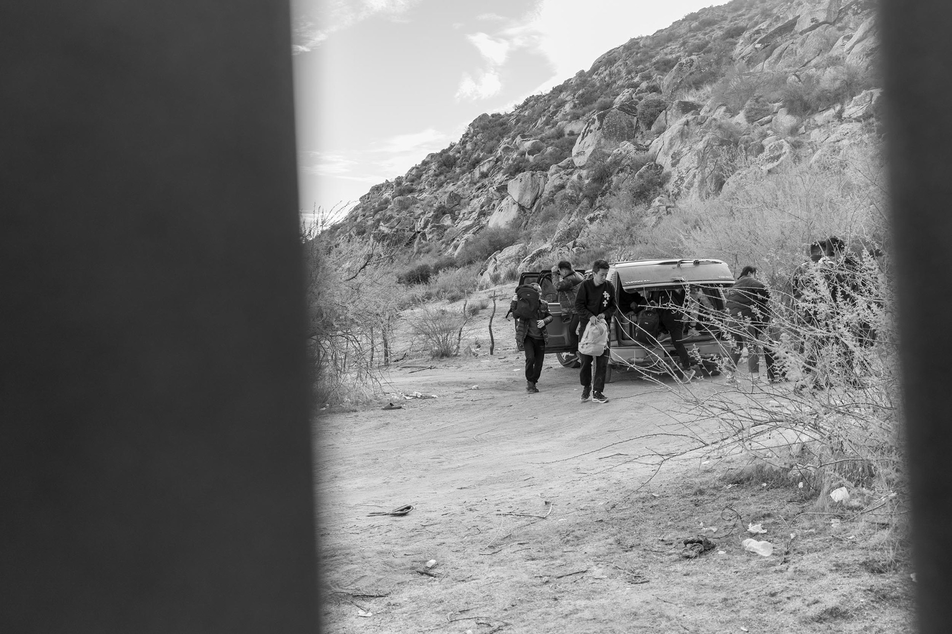 Migrants are being dropped off on the Mexican side of the U.S.-Mexico border wall, just moments before crossing into California.