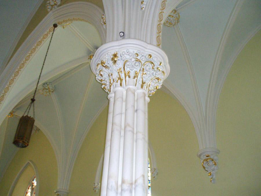 Marble and gilded columns in church by Robert Ireland Studios