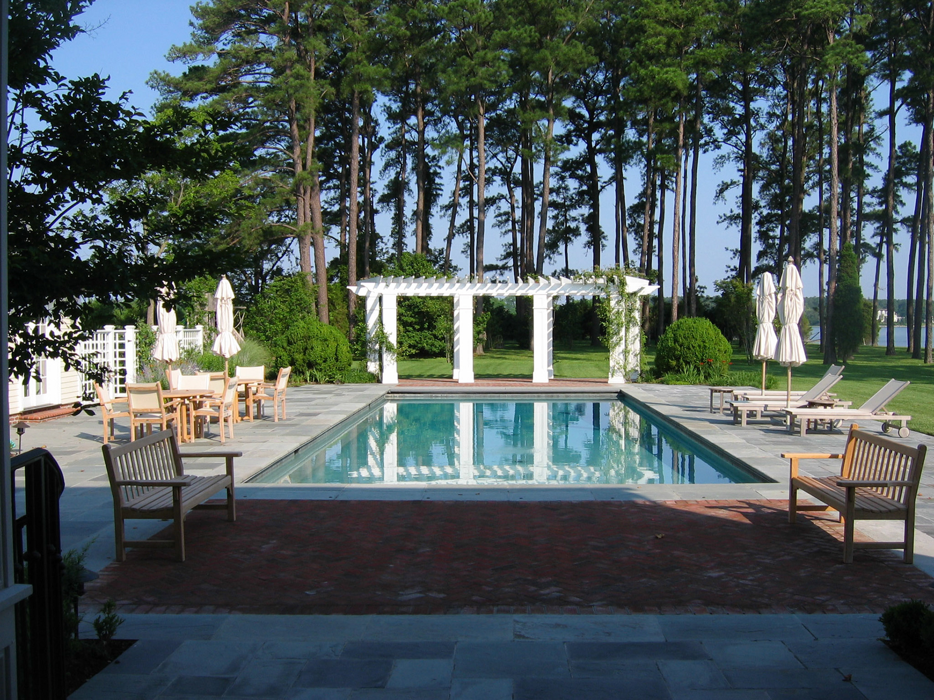 The pool and pergola were laid out on axis with the large house addition, extending the order of the house into the landscape, while engaging with the surrounding Chesapeake Bay