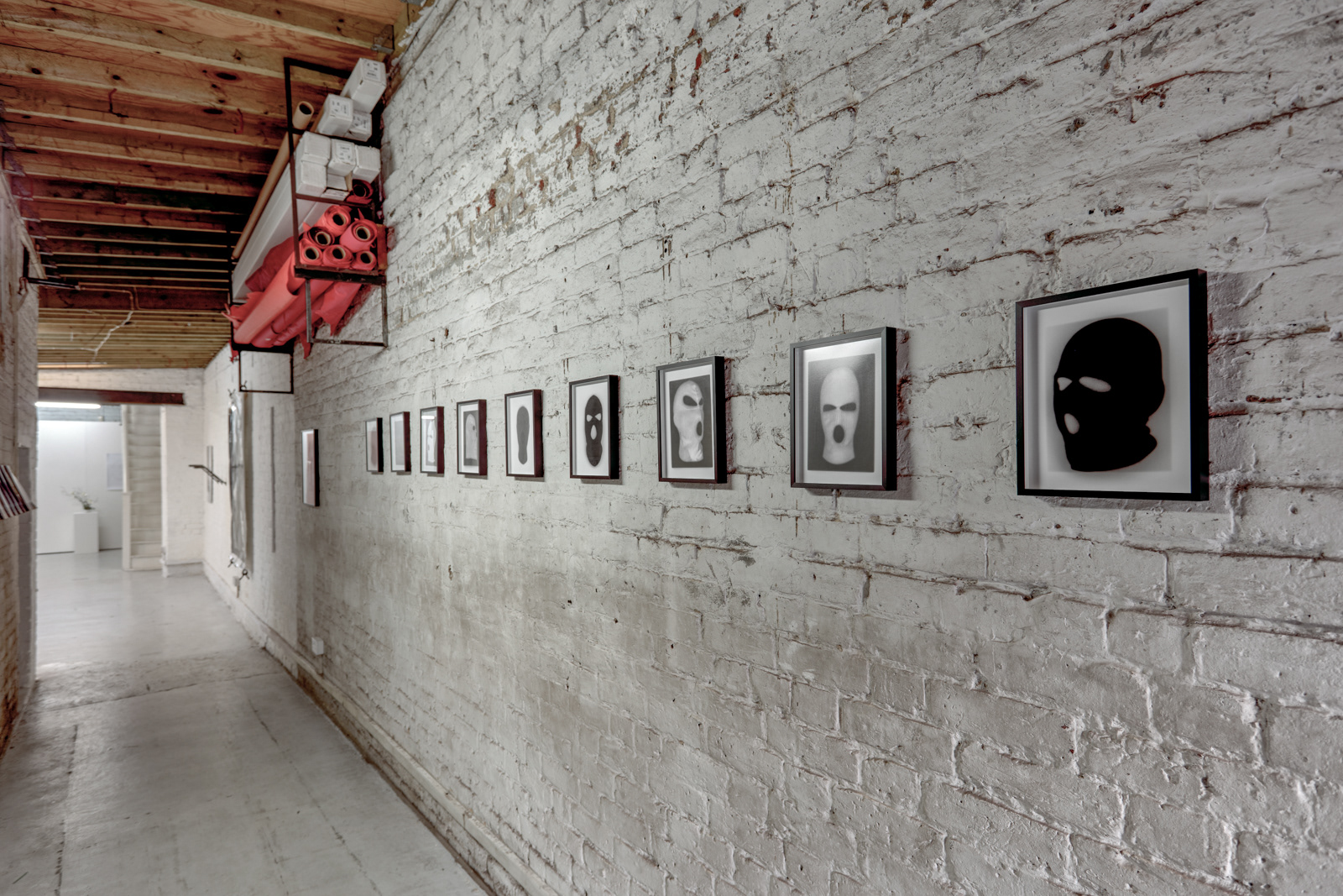 Exhibition installation by martin seeds of terrorist ski mask photographs Northern Ireland terrorism