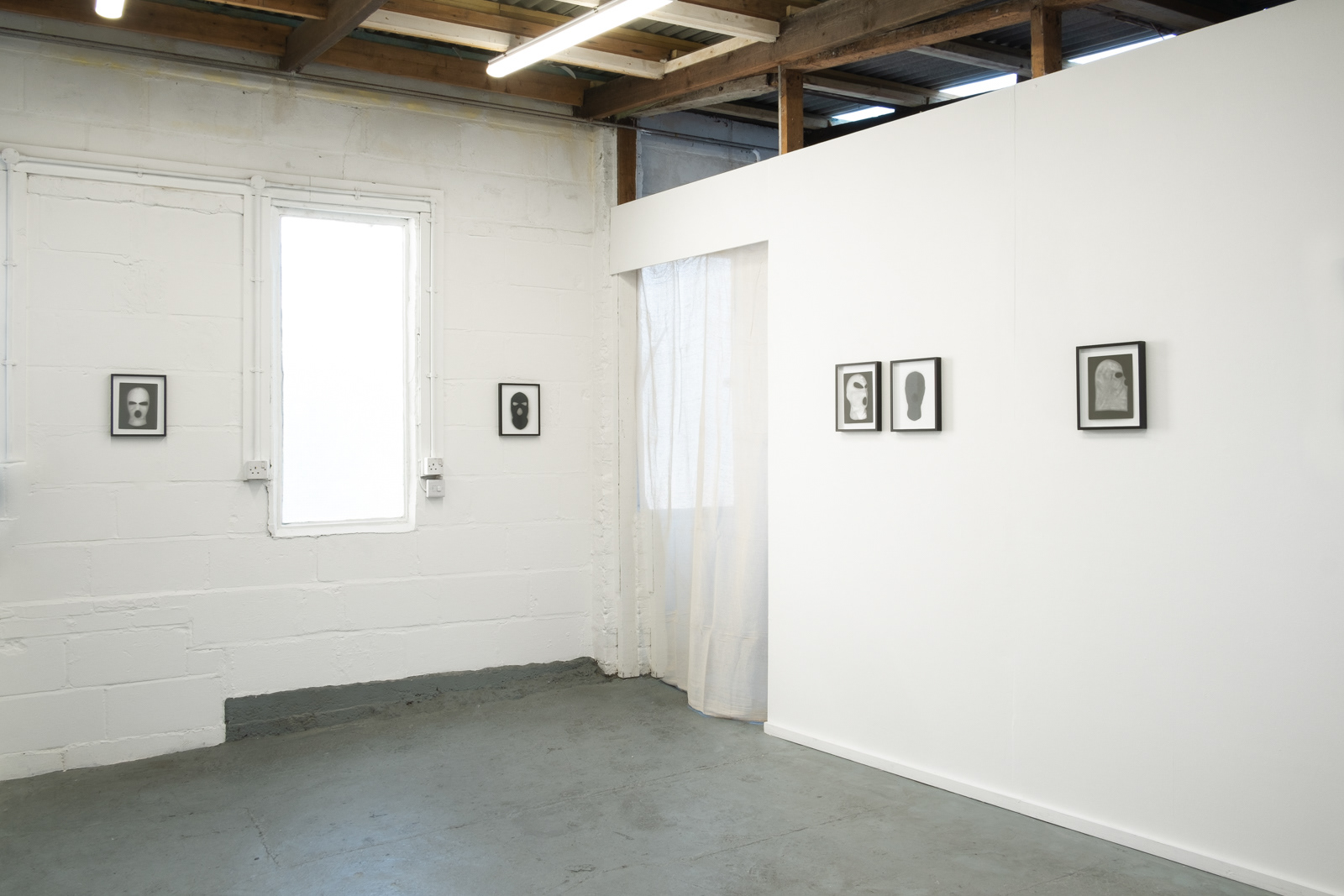 Exhibition installation by martin seeds of terrorist ski mask photographs Northern Ireland terrorism