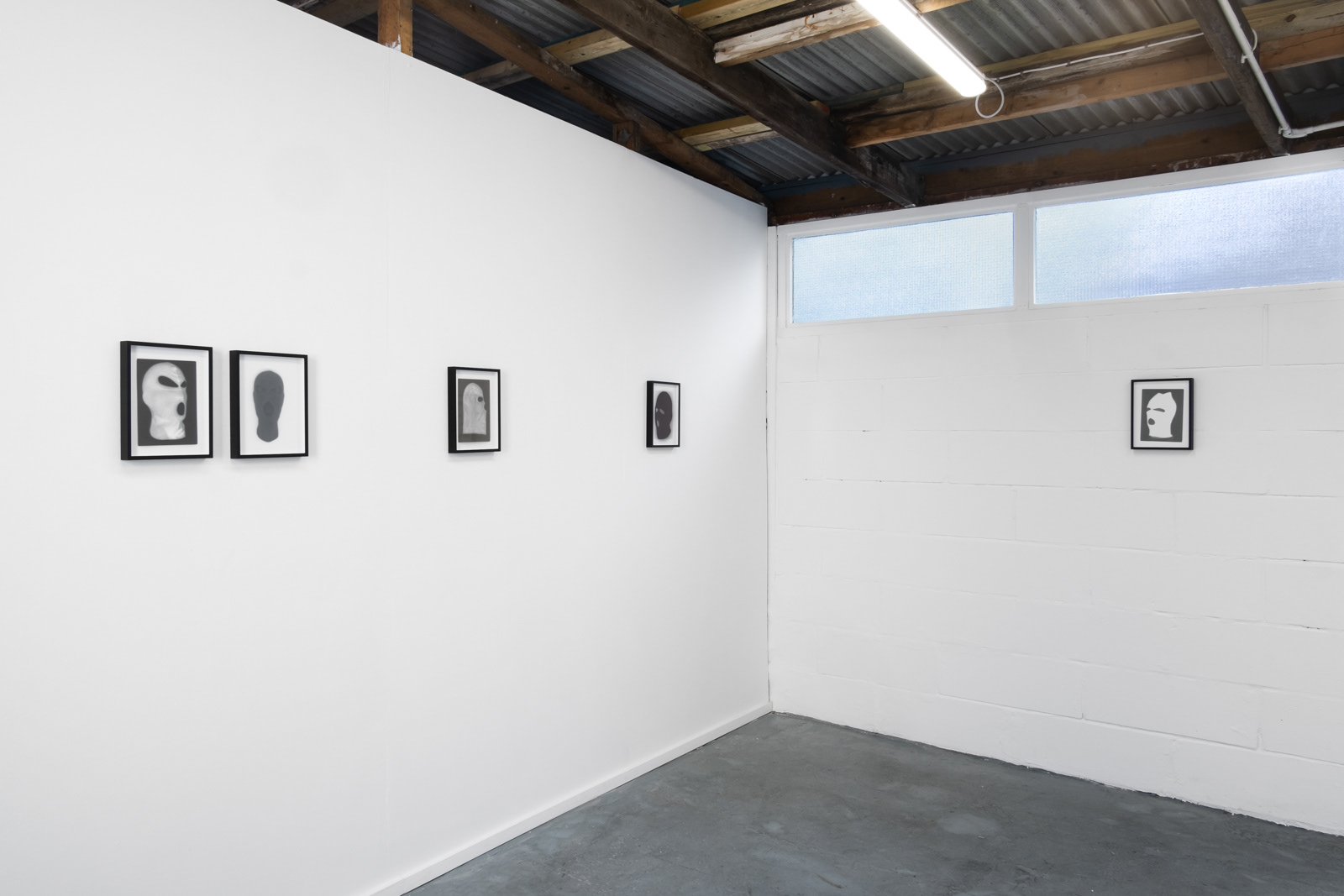 Exhibition installation by martin seeds of terrorist ski mask photographs Northern Ireland terrorism