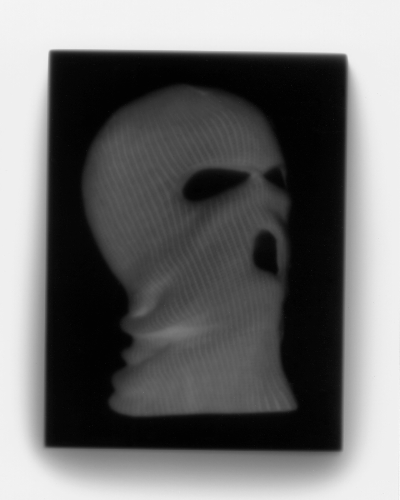 contact printed photograph of a terrorist ski mask made using an iPad in the darkroom