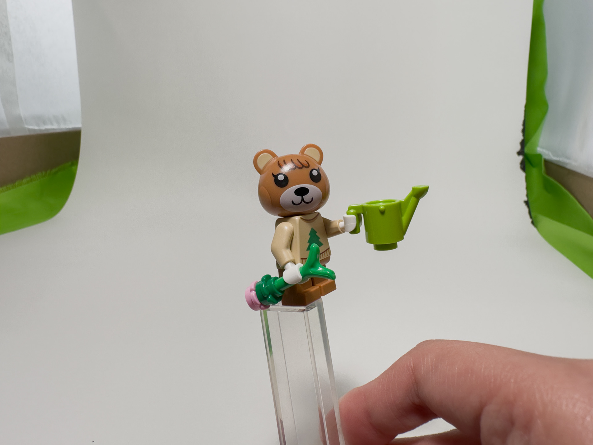 Close up shot of Mabel holding a watering can.