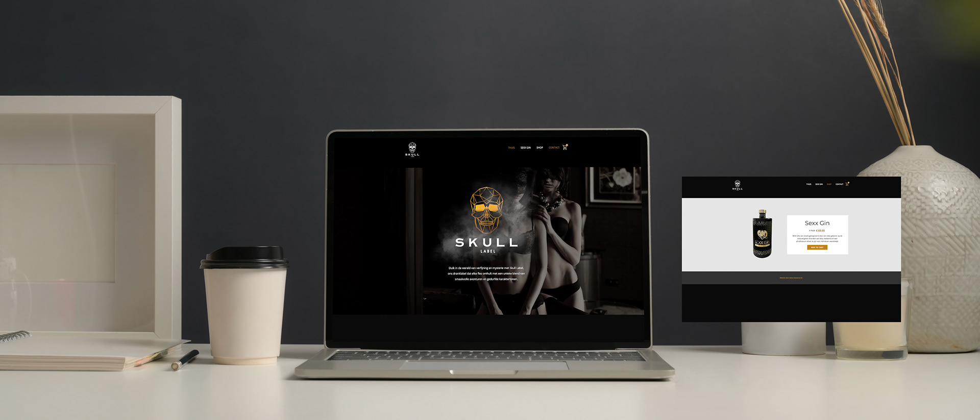 Cropped shot of modern office room with mock up laptop computer, coffee cup, frame and decoration