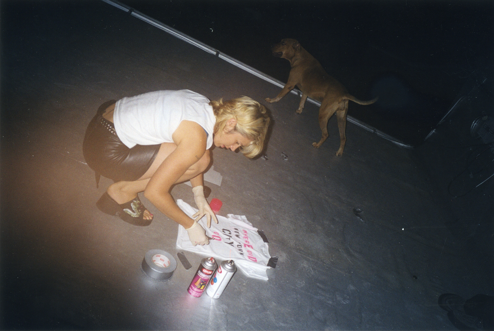 Melanie Vesey stenciling t shirts on the roof, Stanton St.