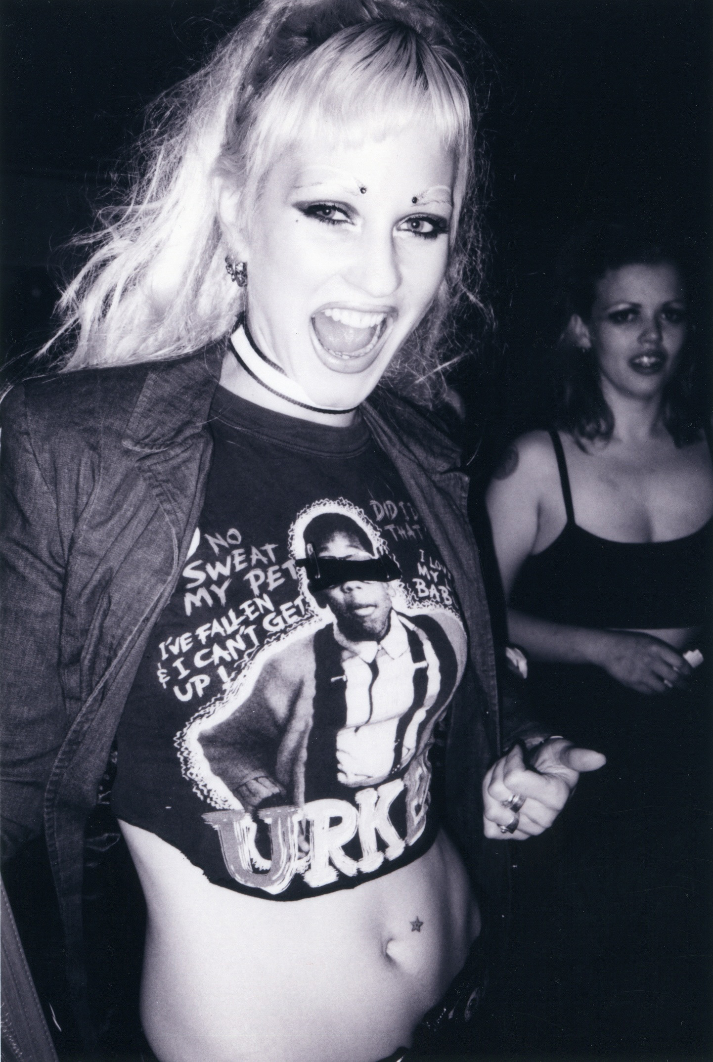 Theo Kogan in an Urkel Shirt at Squeezebox with Michelley Queen of Queens in the background.