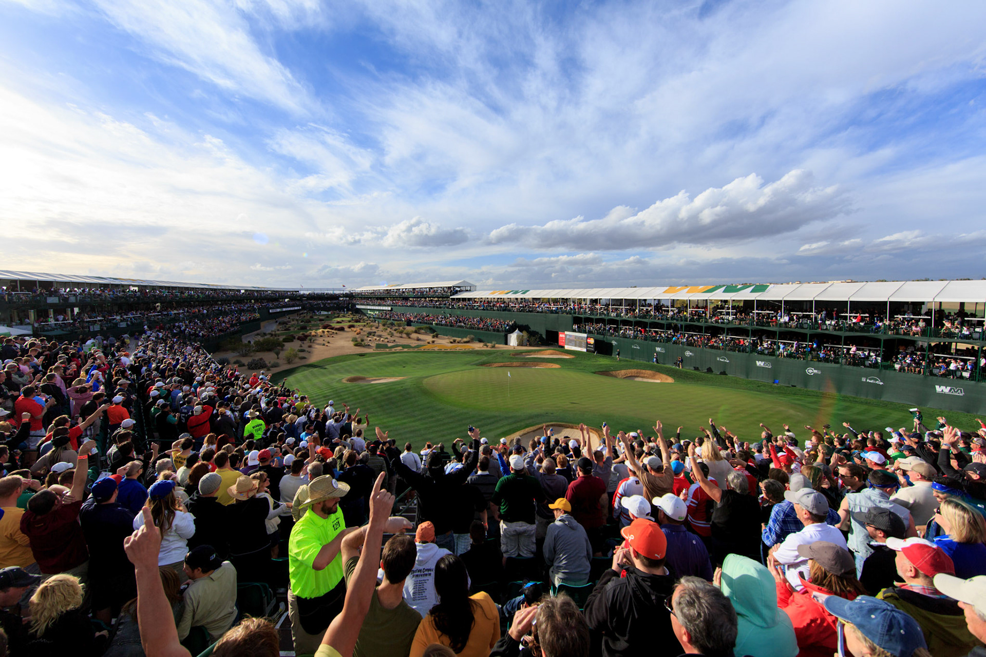 Jan 31, 2014; Scottsdale, AZ, USA;  Fans around the 16th hole reacts in response to Rickie Fowler setting up for his tee shot on the par 3 16th hole during the second round of the Waste Management Phoenix Open at TPC Scottsdale. Mandatory Credit: Allan Henry-USA TODAY Sports