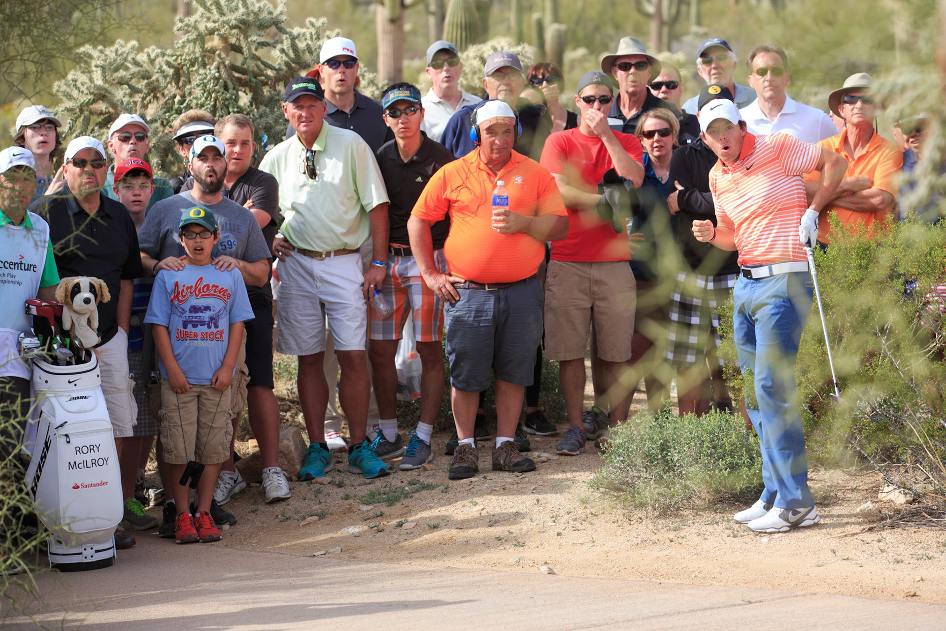 Feb 19, 2014; Marana, AZ, USA; Rory McIlroy reacts after hitting his shot from the desert left of the 14th fairway during the first round of the World Golf Championships - Accenture Match Play Championship at The Golf Club at Dove Mountain. Mandatory Credit: Allan Henry-USA TODAY Sports