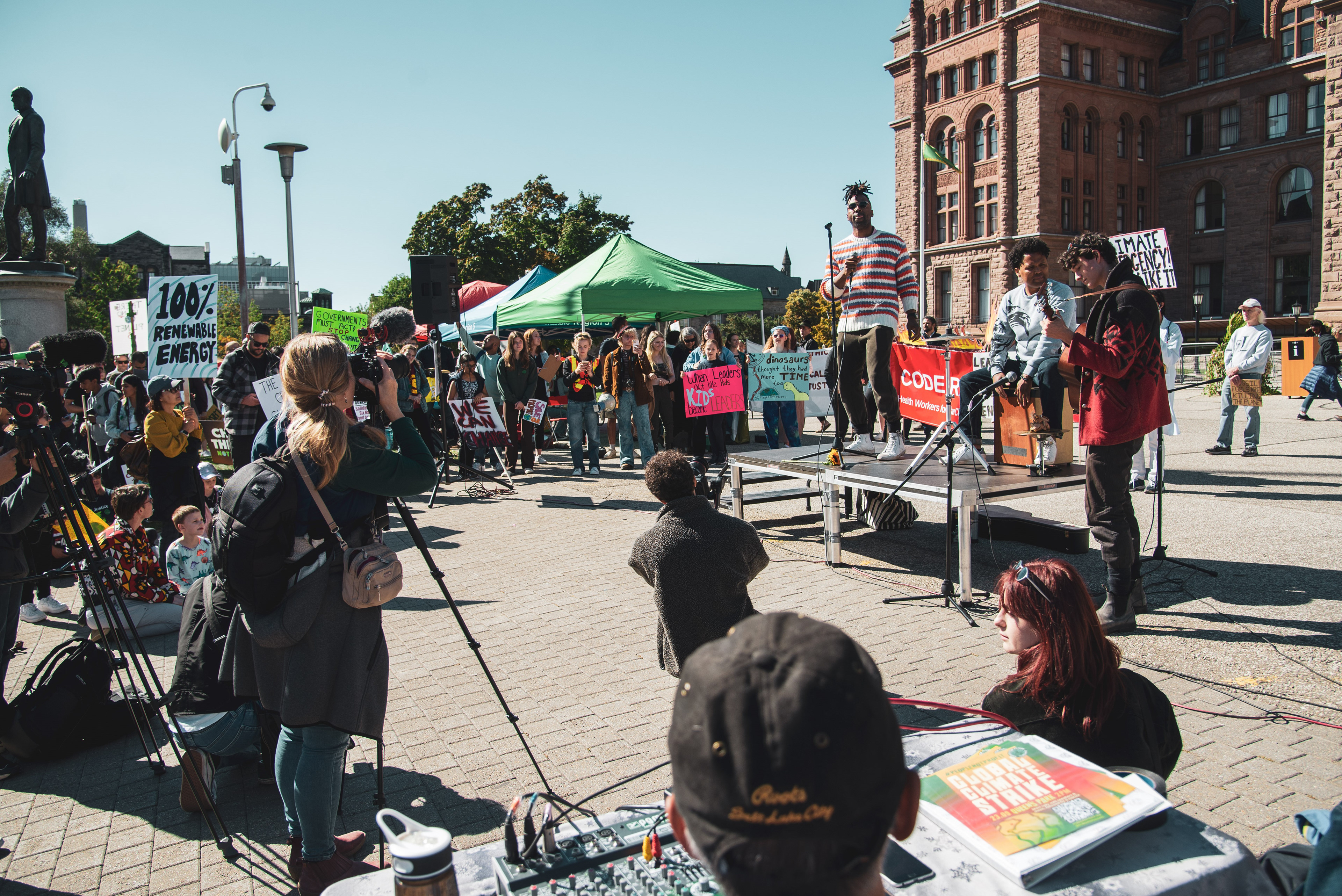 Jamaican musician LGBTQ+ activist Mark Clennon performs at the climate rally.