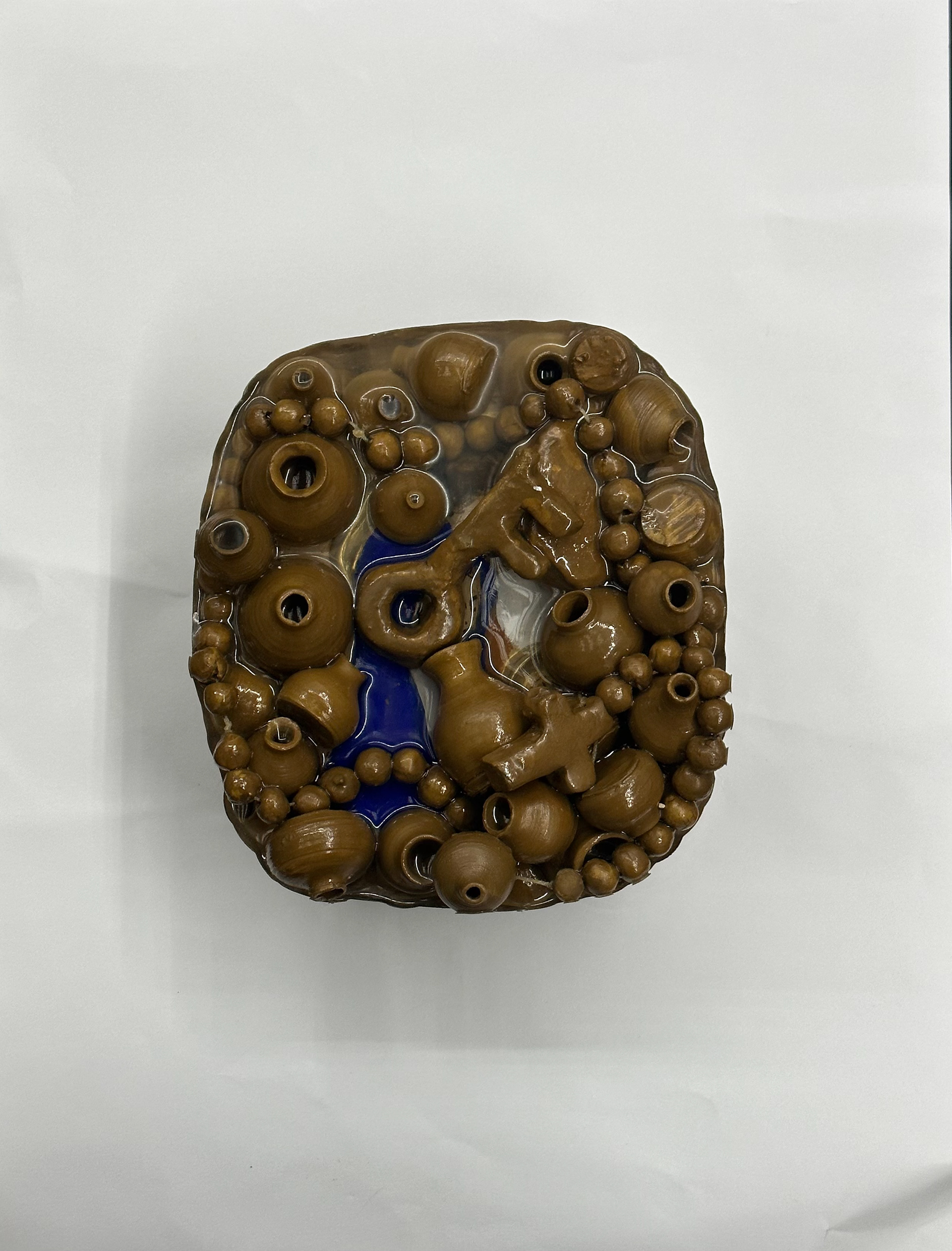 Rumination (above view: icon of the Holy Family, key of return, rosary, jar), 2023-2025, mixed technique (clay, thread and epoxy resin), 18cm*10cm*17cm