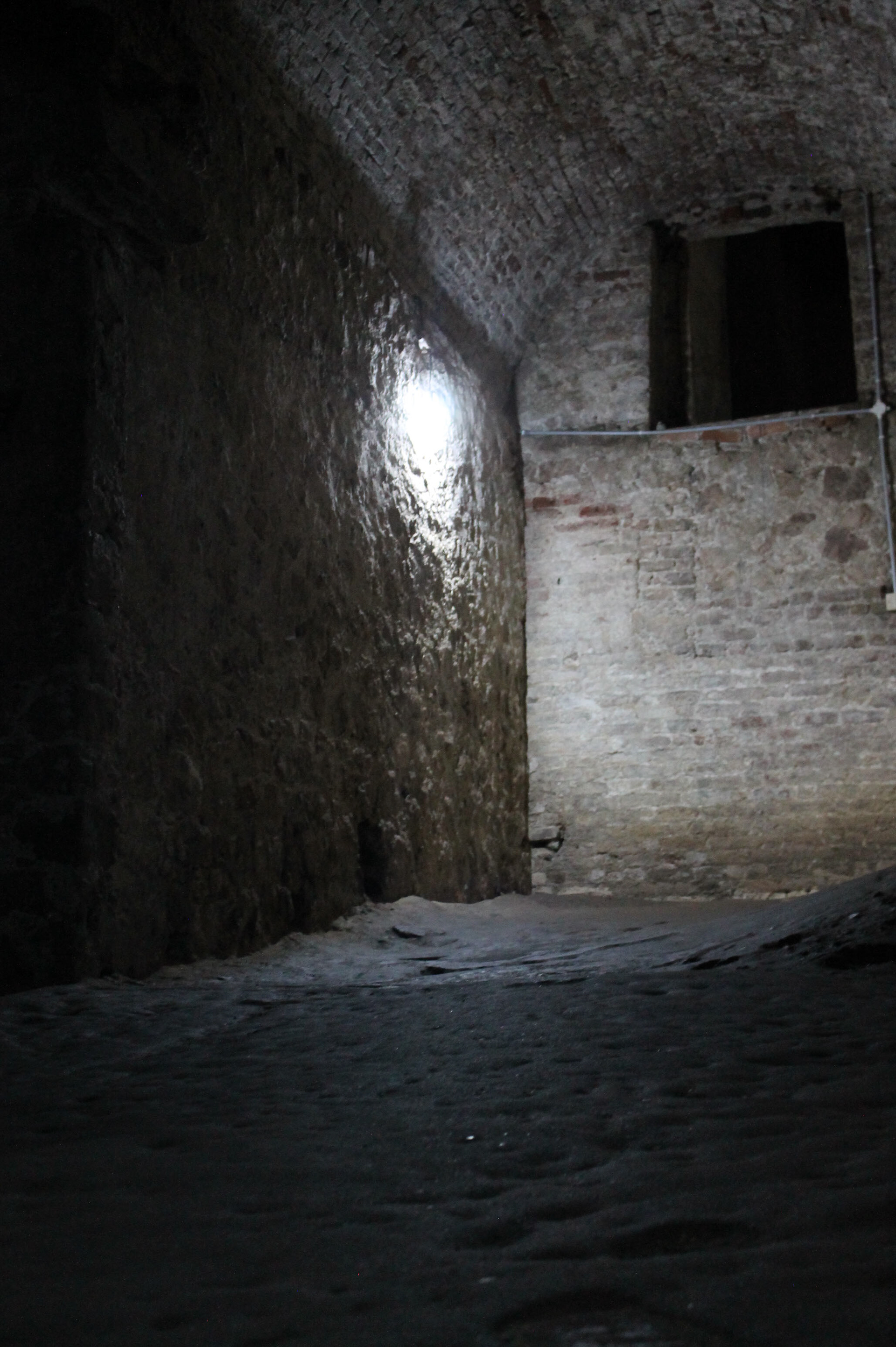 The floor of the dungeons covered in a thick hardened layer of dirt, flesh, and bodily fluids.