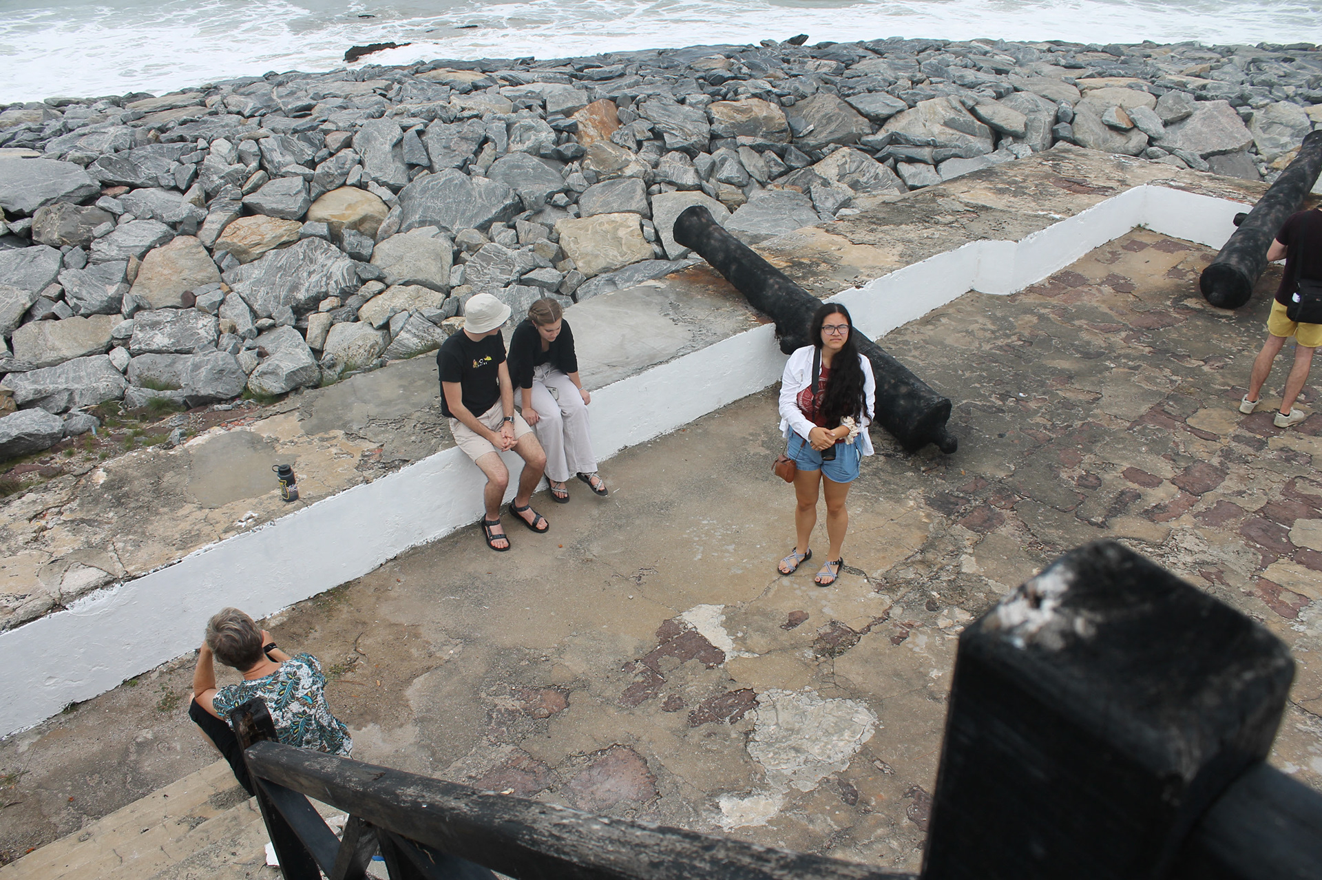University of Oregon students taking in the outside of Elmina castle before entering.