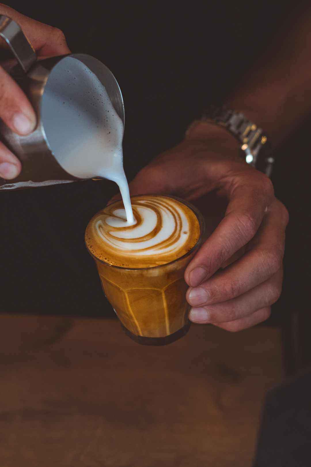 Barista Peyman pouring a tulip at Viktors Kaffe in Gothenurg