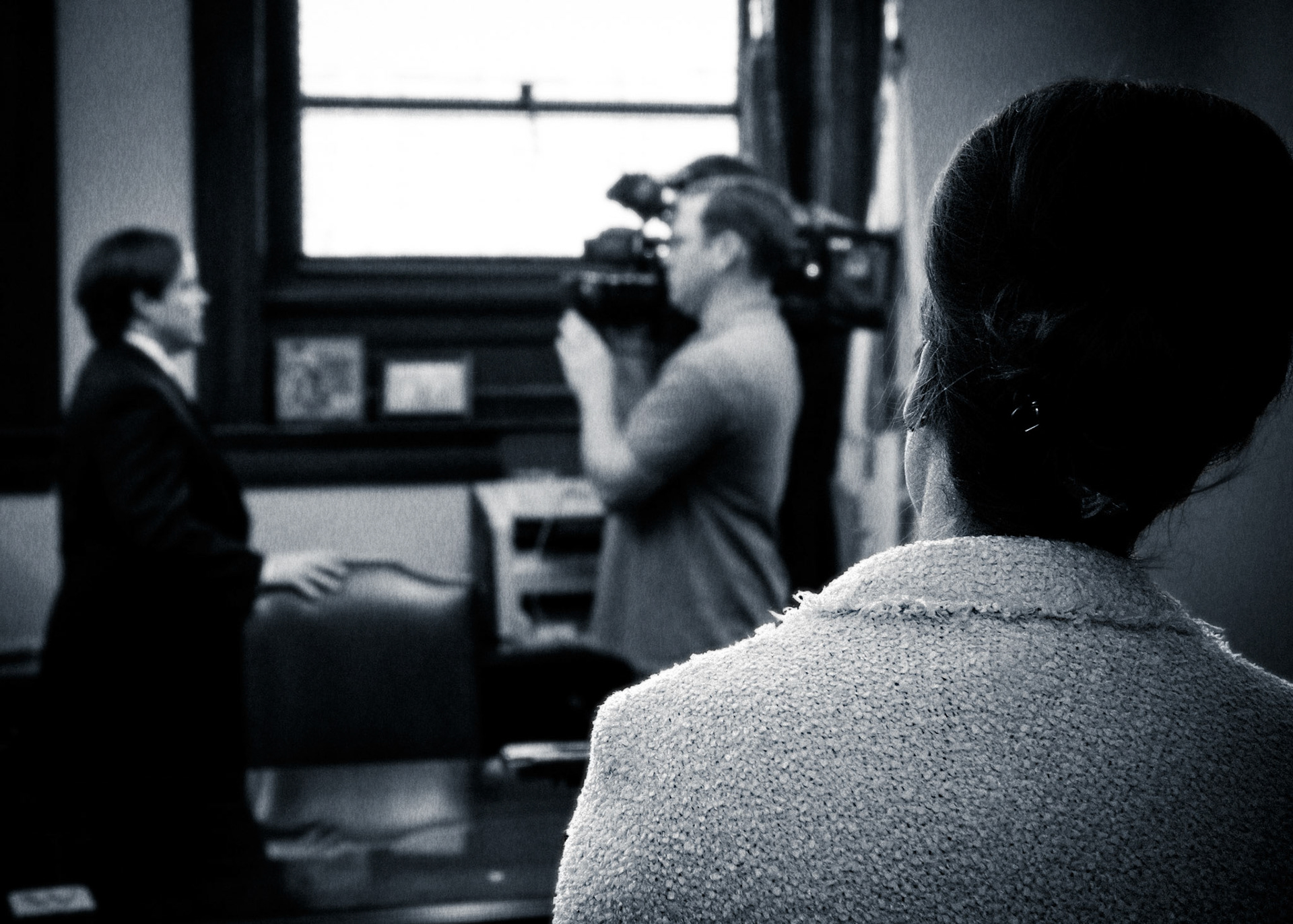 Newly Sworn Arkansas State Senator Jon Woods is interviews by News Reporters as his Fiance' stands at the door to his office.