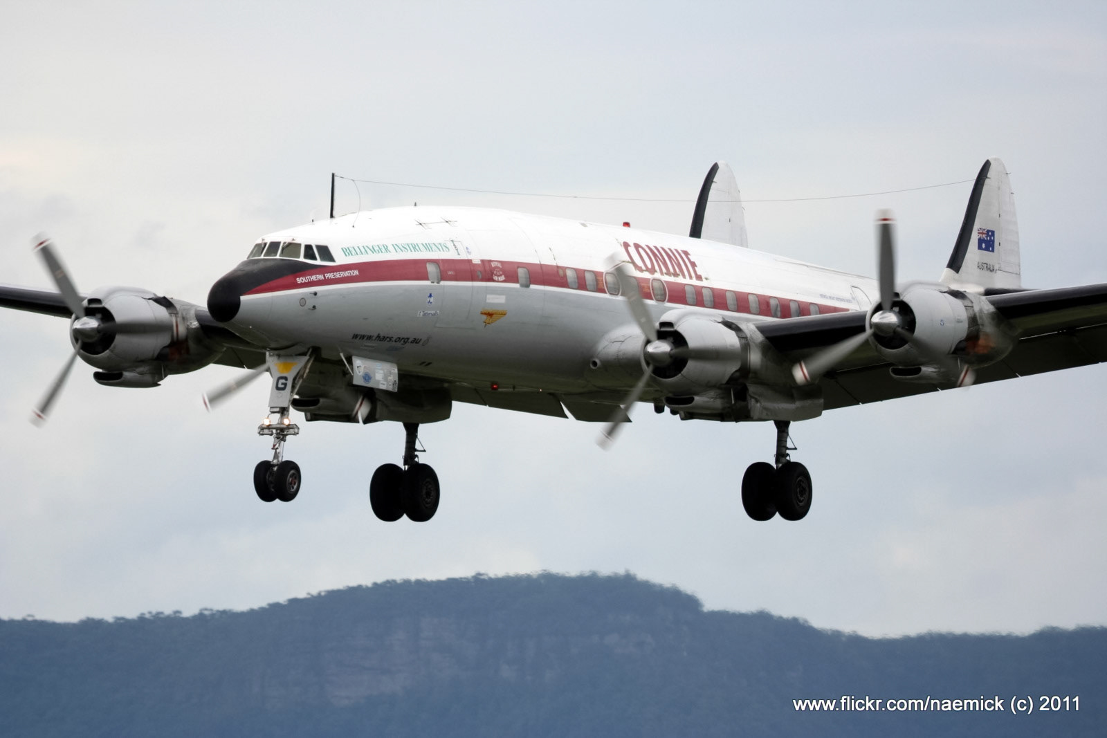 A Lockheed Super Constellation, named "Connie," with "BELLINGER INSTRUMENTS" and "SOUTHERN PRESERVATION" visible, approaches for landing.